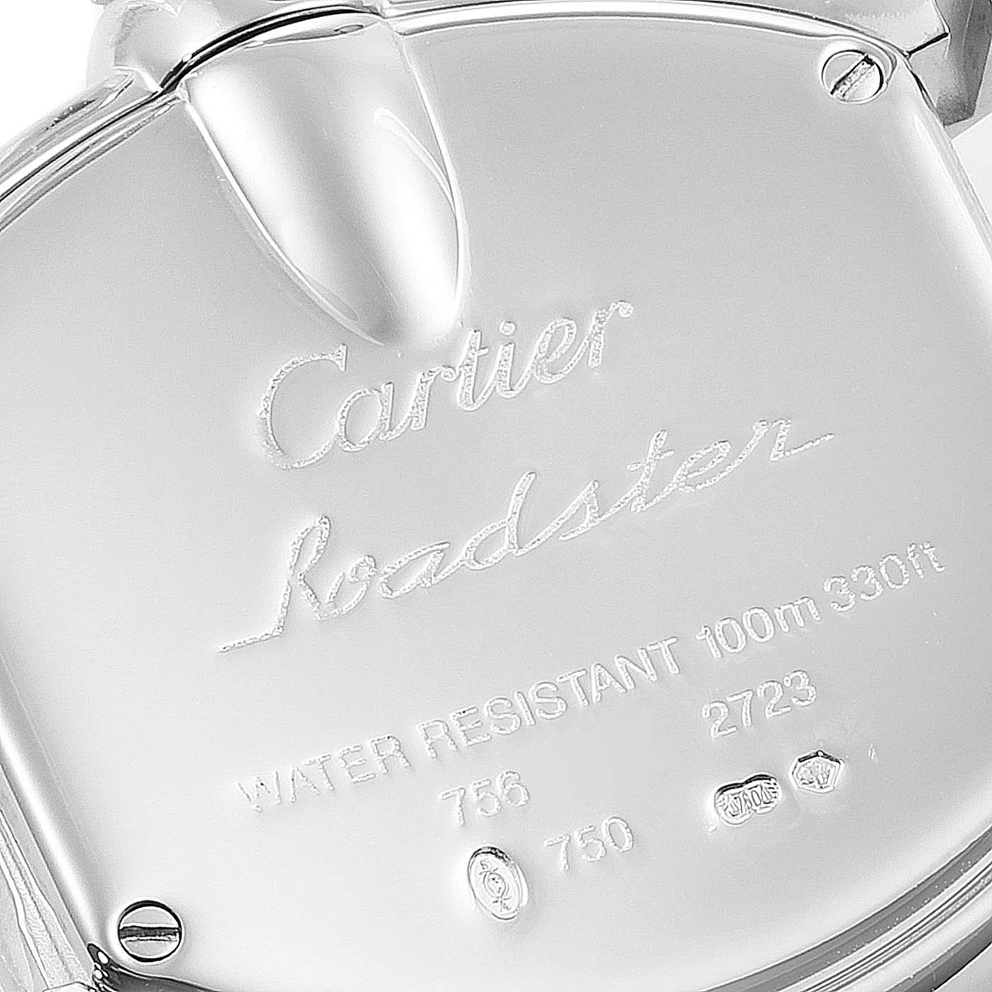 The image shows a close-up of the back case of a Cartier Roadster WE500260 Women
s White Gold Silver Dial WE500260 Women
s White Gold Silver Dial watch, featuring engraved details and markings.