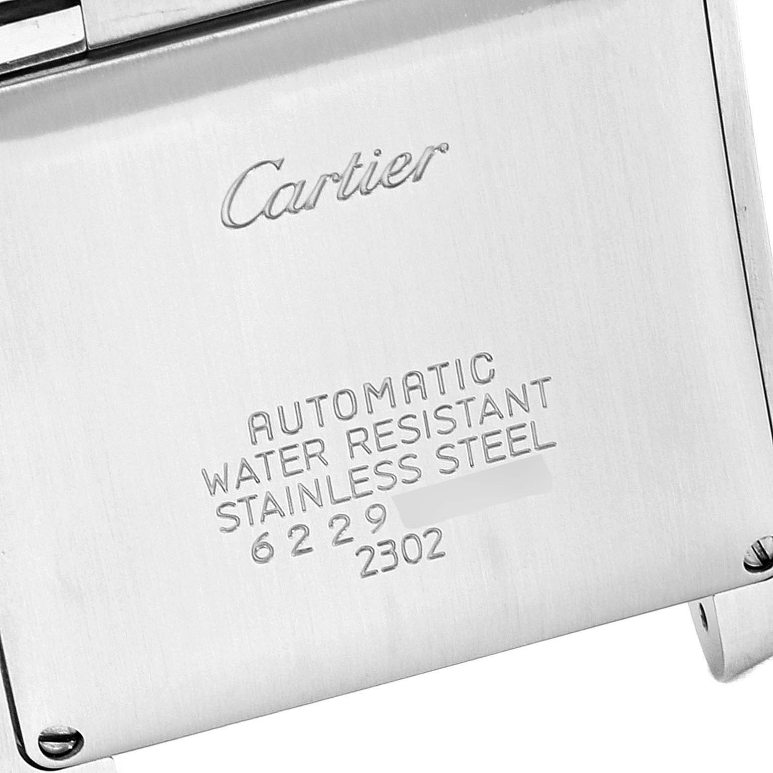 This image shows the back casing of a Cartier Tank Francaise W51002Q3 Men's Stainless Steel Silver Dial W51002Q3 Men's Stainless Steel Silver Dial watch, highlighting the engraved brand, model specifications, and serial numbers.