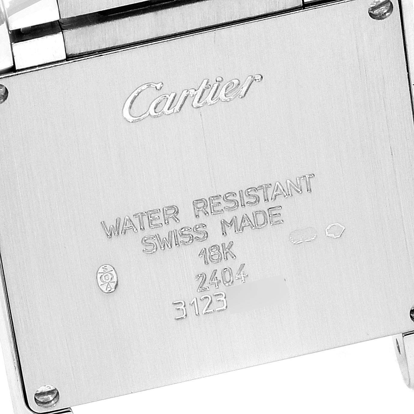 This image shows the backside of the Cartier Tank Française watch, highlighting its engraved details and inscriptions.