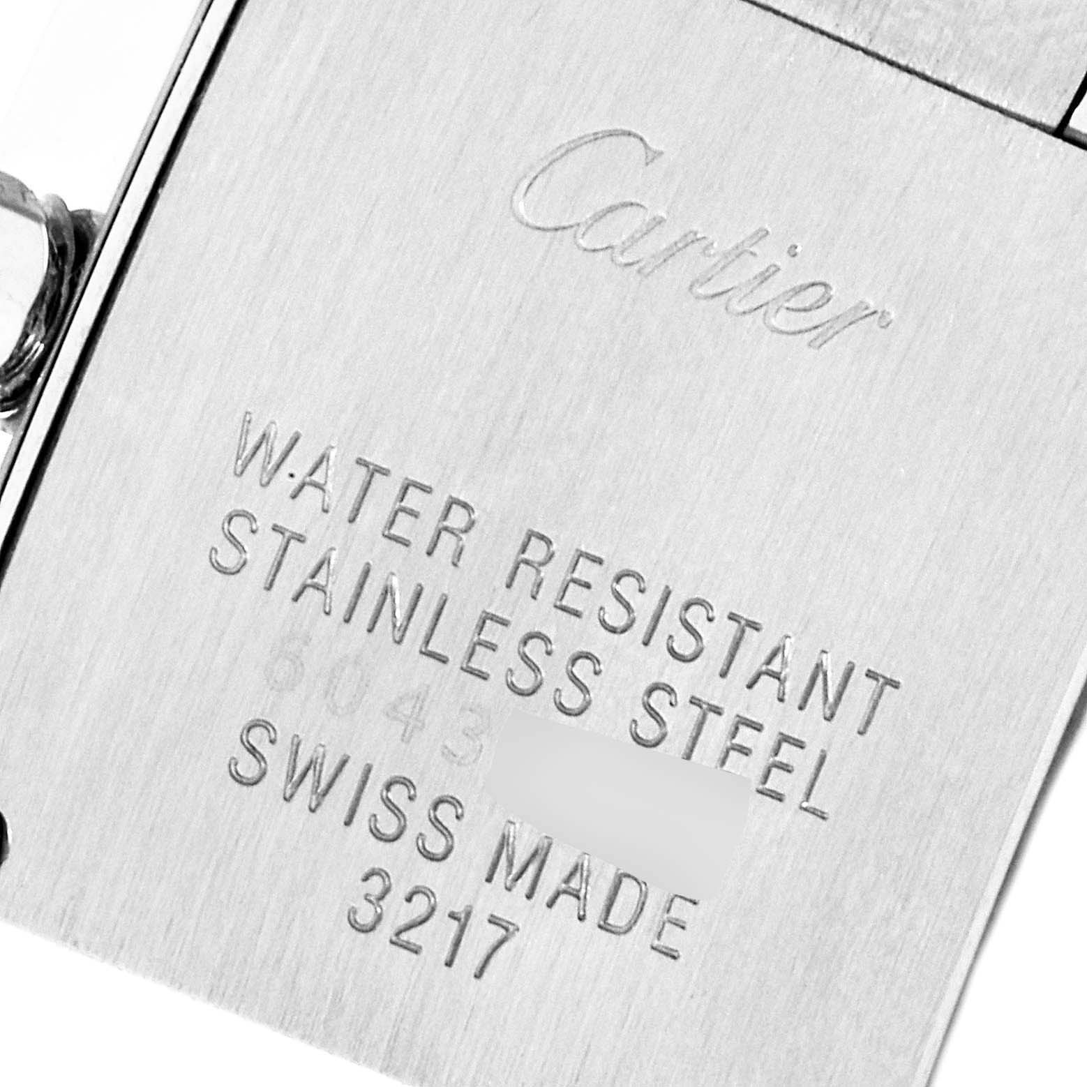 This is a close-up view of the back case of a Cartier Tank Francaise W4TA0008 Women
s Stainless Steel Silver Dial W4TA0008 Women
s Stainless Steel Silver Dial watch, showing brand engravings and model details.