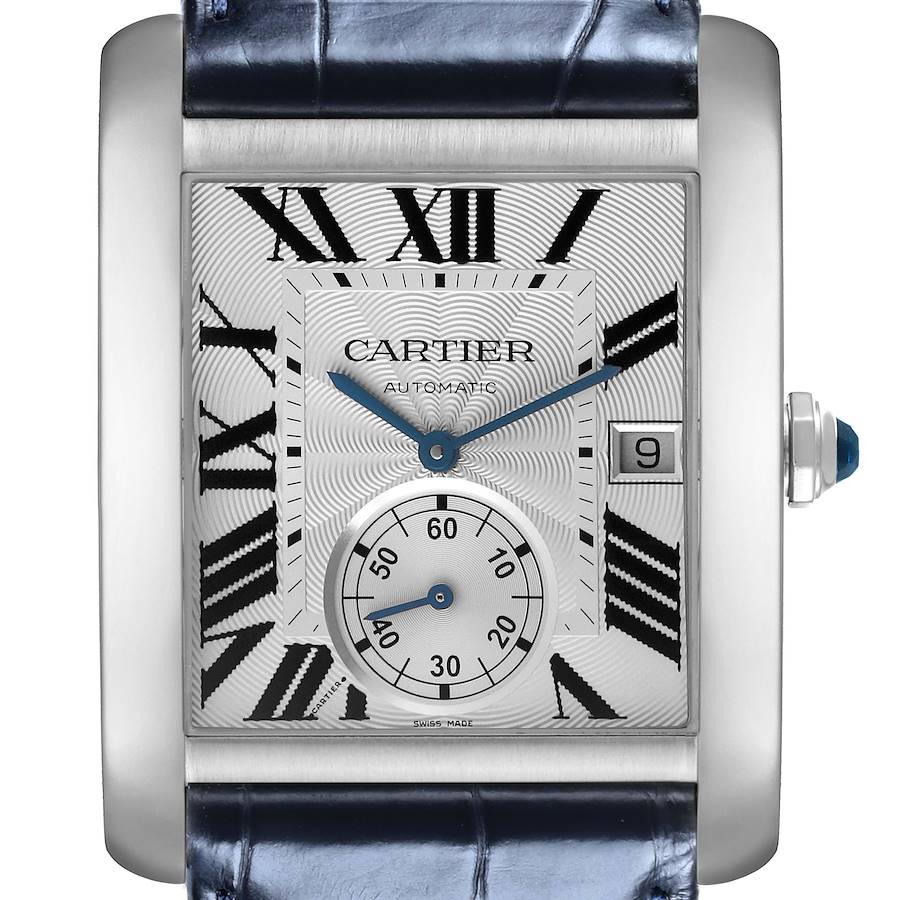 The Cartier Tank MC watch is shown from a front angle, displaying the dial, hands, date window, and strap.