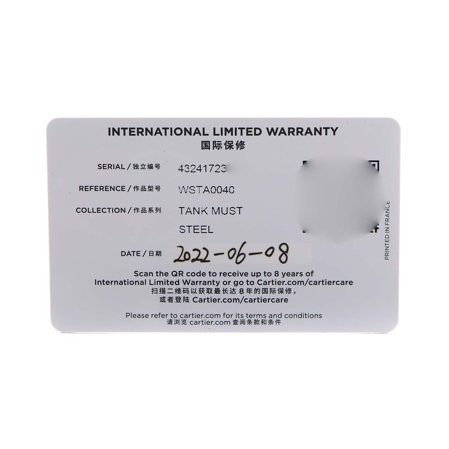 The image shows the International Limited Warranty card for a Cartier Tank Must WSTA0040 Men's Stainless Steel Silver Dial model watch.