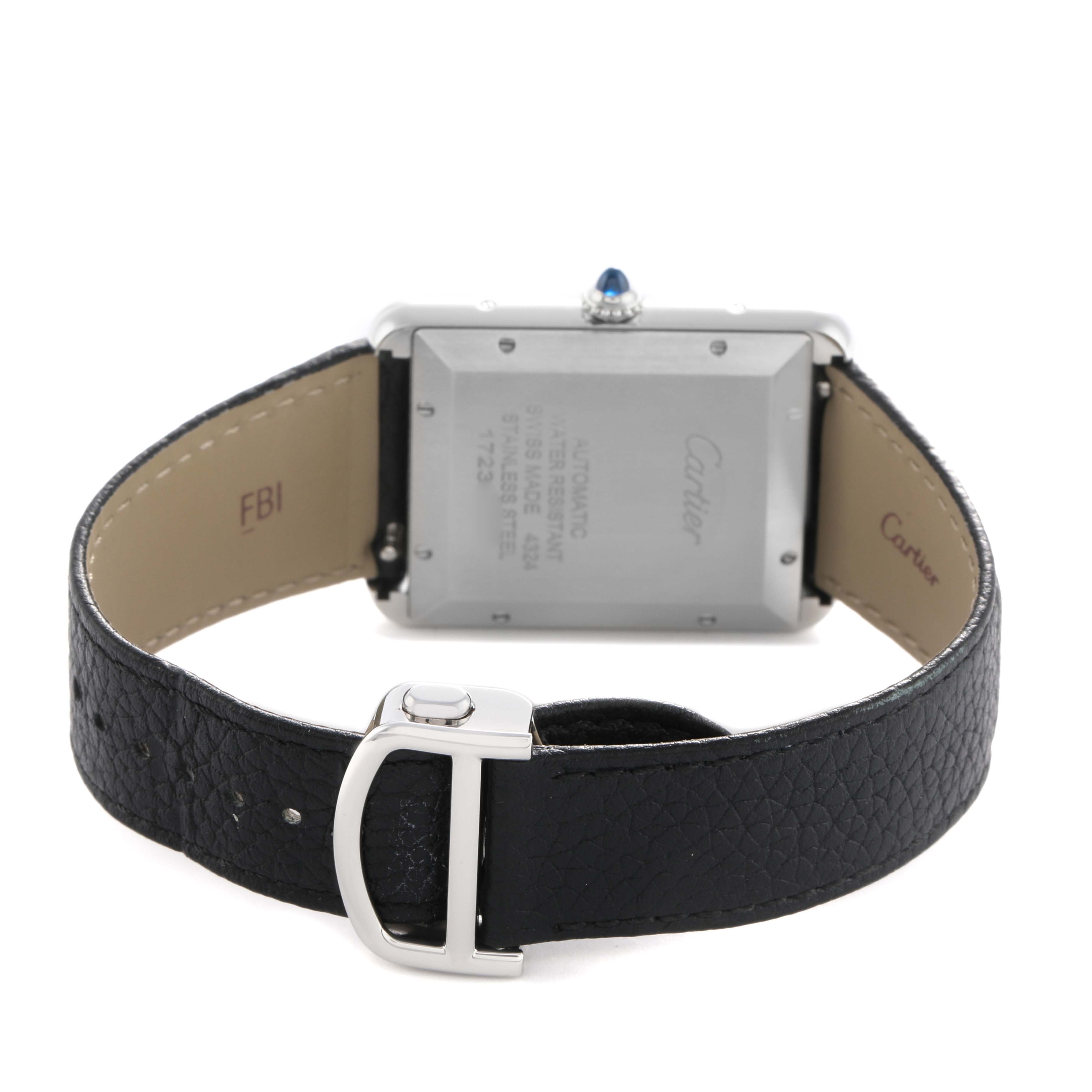 The image shows the back of a Cartier Tank Must WSTA0040 Men's Stainless Steel Silver Dial watch, including the case, crown, and black leather strap with a buckle.