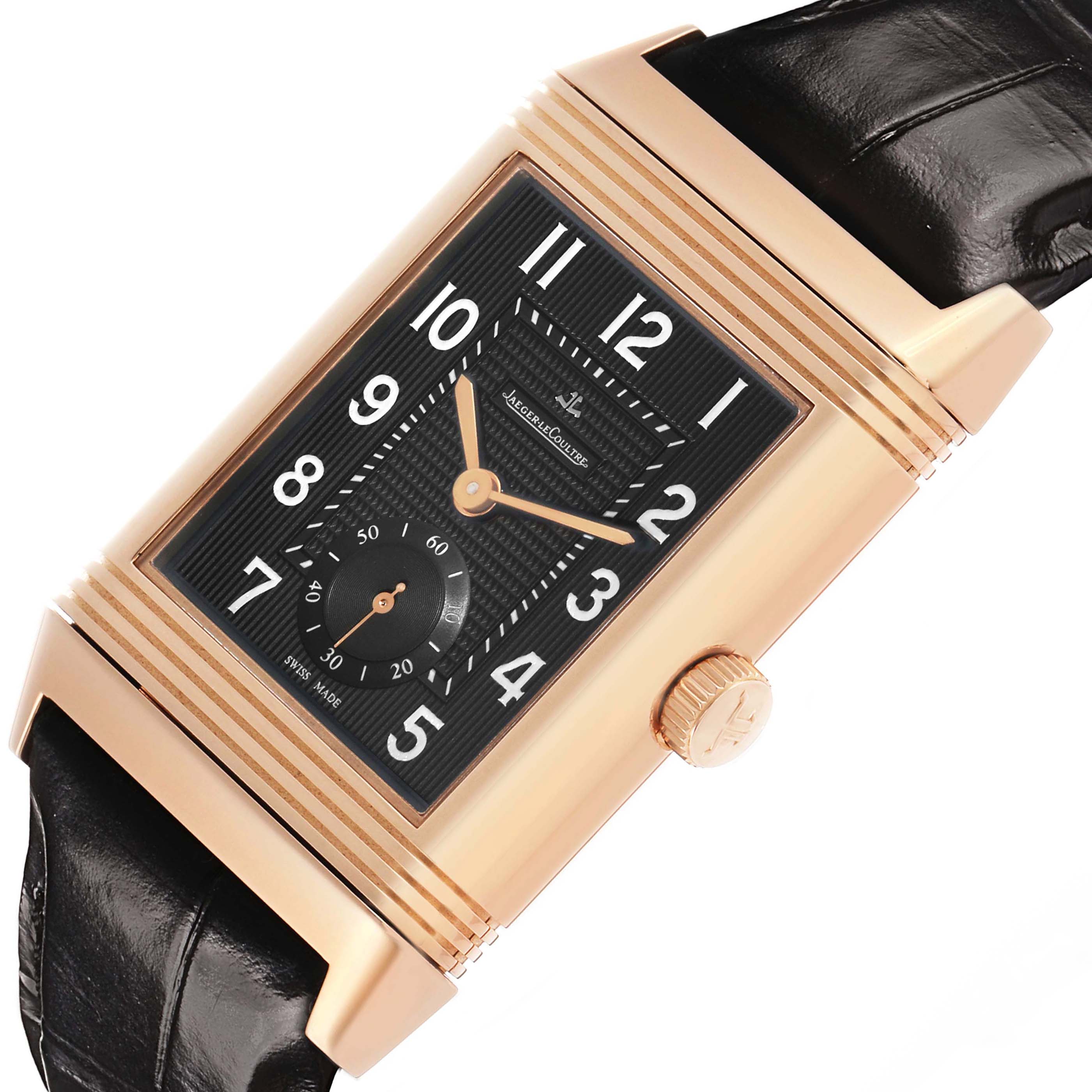 The Jaeger-LeCoultre Reverso watch is shown at an angle displaying the face, case, crown, and part of the leather strap.