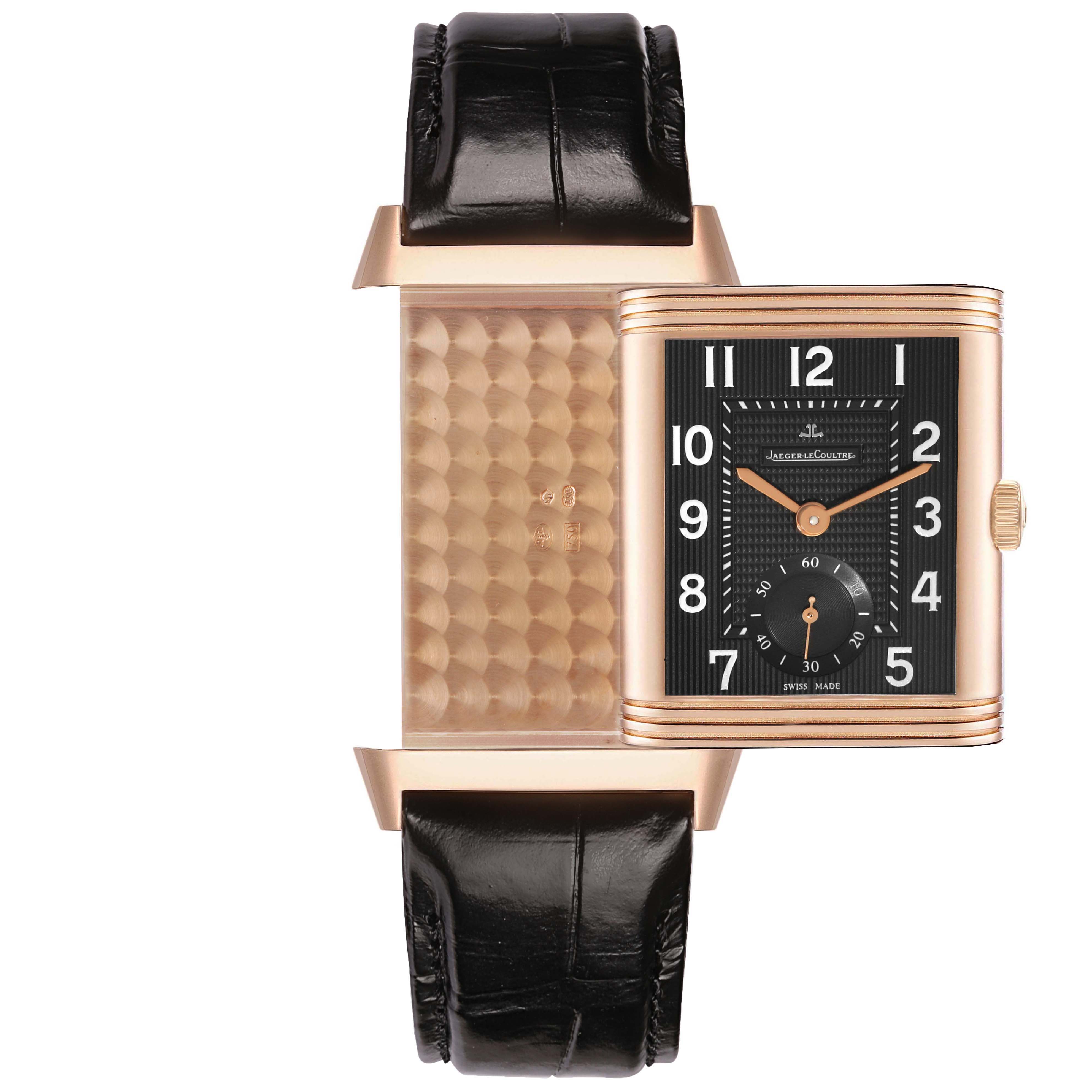 The Jaeger-LeCoultre Reverso watch is shown in a front view with its case swiveled to reveal both the watch face and decorative back.