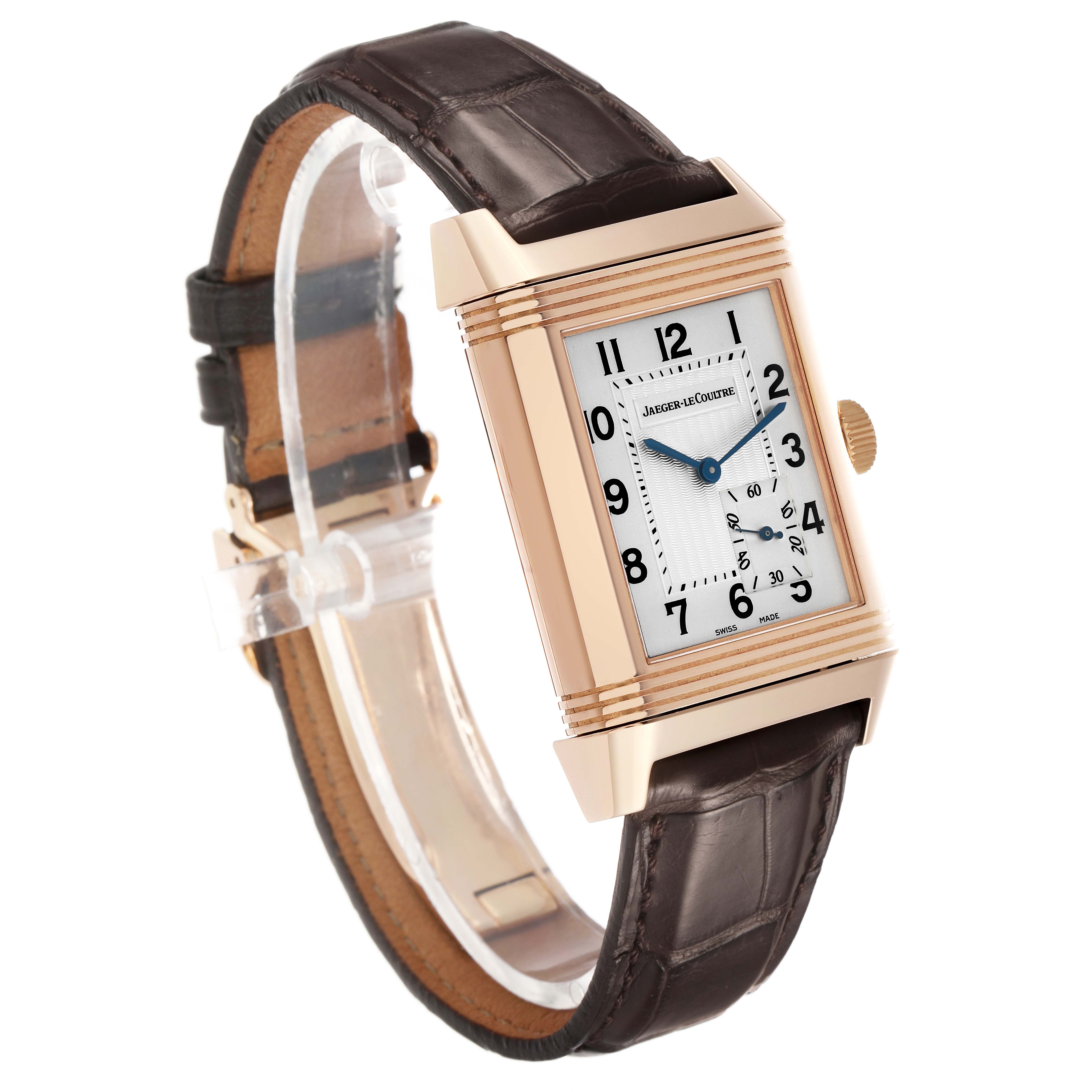 The Jaeger-LeCoultre Reverso watch is shown at a three-quarter angle, featuring the case, dial, crown, and leather strap.