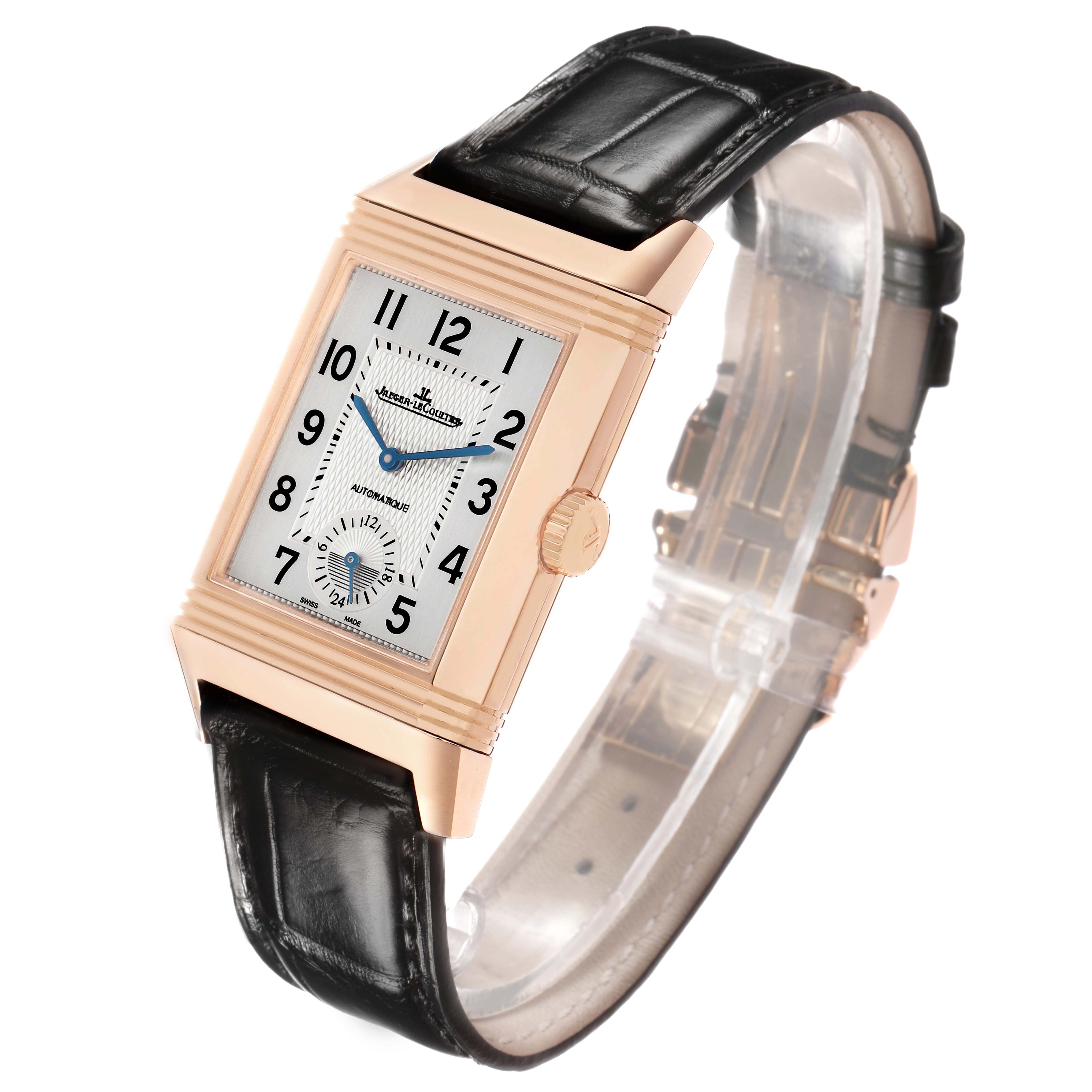 The image shows a Jaeger-LeCoultre Reverso model from a front angle, highlighting its rectangular face, crown, and leather strap.
