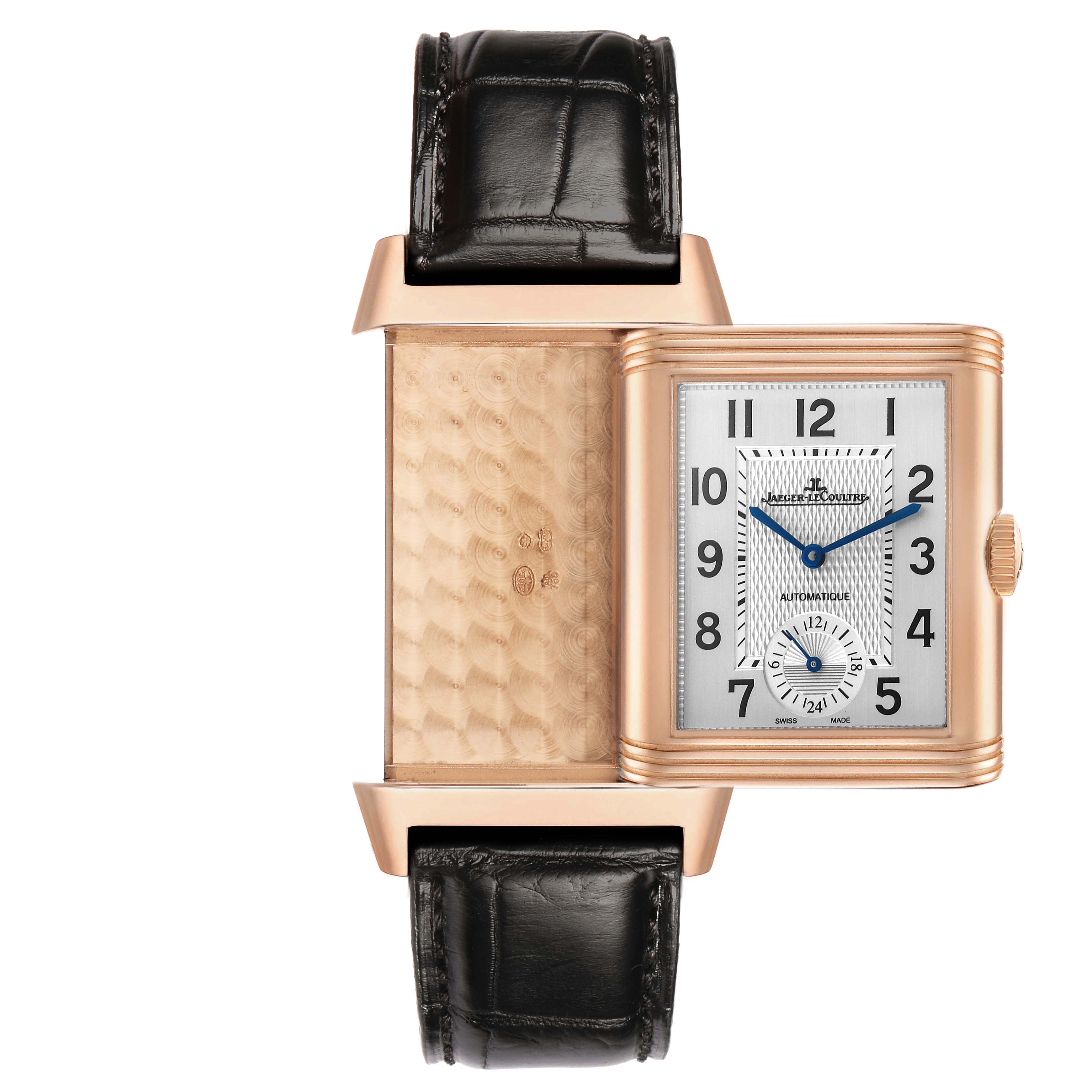 The image shows a Jaeger LeCoultre Reverso Q3832420 Men's Rose Gold Silver Dial watch at an angle that reveals both the dial and the intricate design on the opposite side of the case.