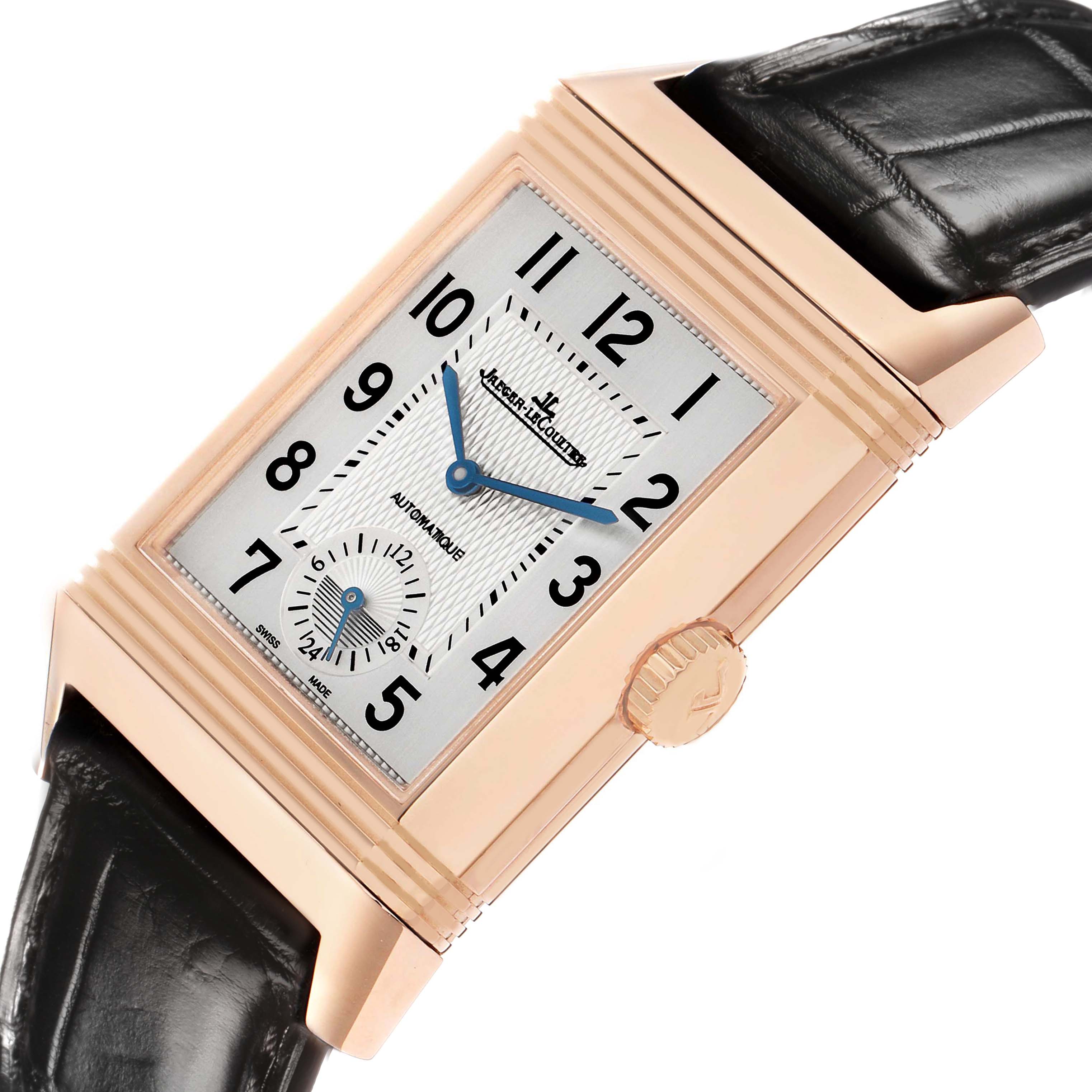 The Jaeger-LeCoultre Reverso watch is shown at an angled view, displaying its rectangular face, elegant dial, and crown.