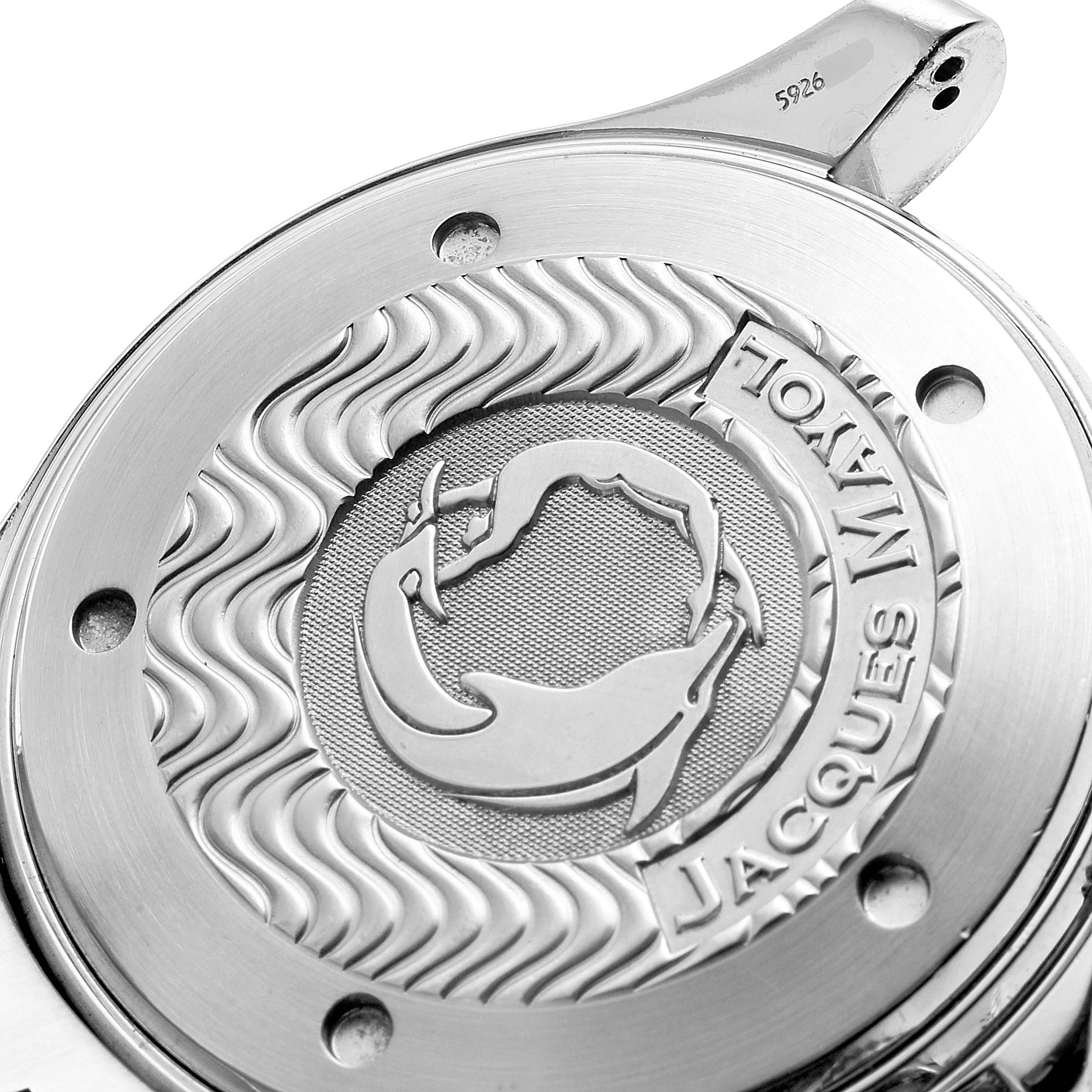 The image shows a close-up view of the Omega Seamaster 2595.50.00 Men's Stainless Steel Black Dial 2595.50.00 Men's Stainless Steel Black Dial's case back, featuring an engraved design.