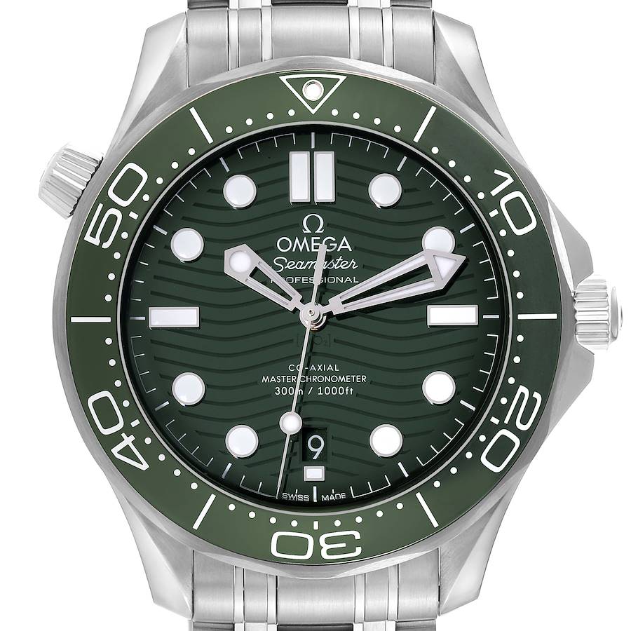 The Omega Seamaster is shown from a front angle, displaying the green dial, bezel, and stainless steel bracelet.