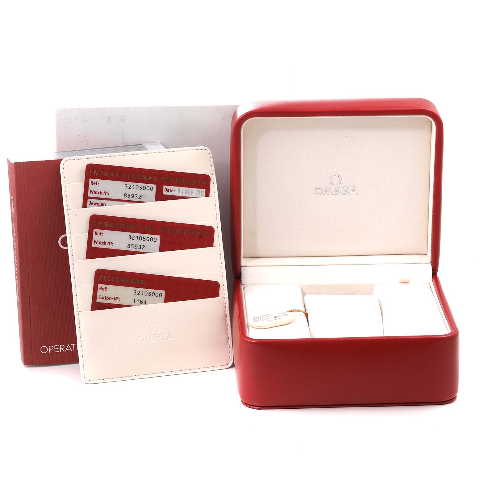 The image shows an Omega Speedmaster 3210.50.00 Men
s Stainless Steel Black Dial 3210.50.00 Men
s Stainless Steel Black Dial watch box, warranty cards, and an operating manual, viewed from an angle highlighting the accessories.