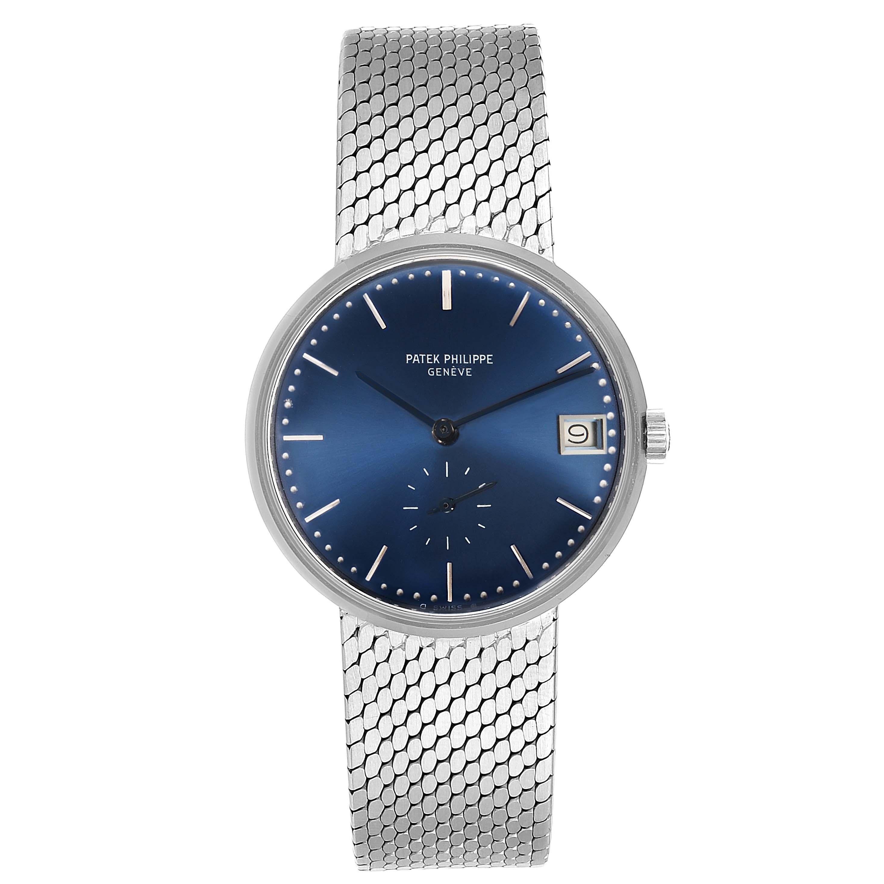 This image shows a front view of the Vintage Patek Philippe watch featuring a blue dial, silver mesh strap, and date display at three o'clock.