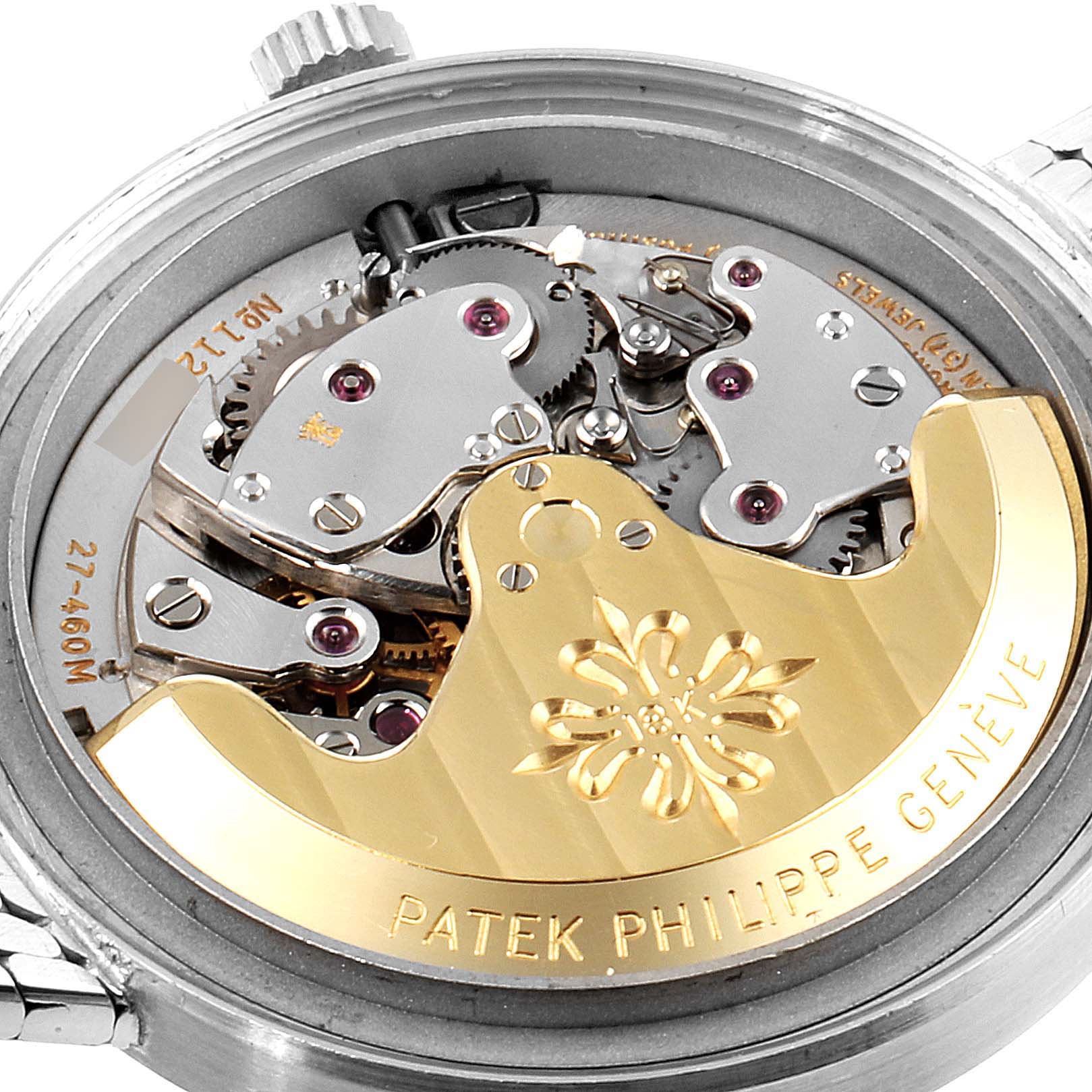 The image shows the back view of the Patek Philippe Vintage watch, highlighting its intricate movement and rotor.