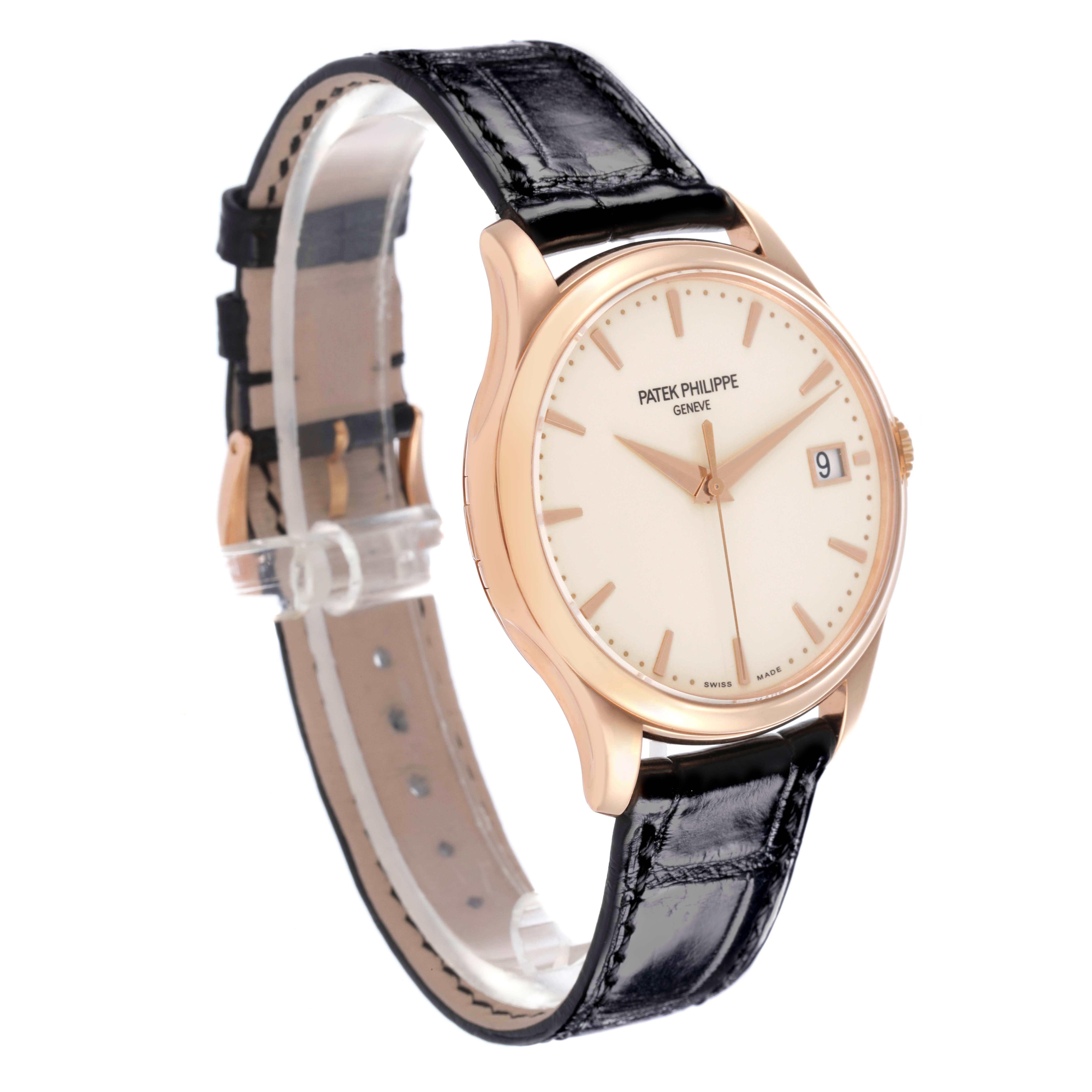 The Patek Philippe Calatrava 5227R-001 Men's Rose Gold Champagne Dial watch is shown at an angled side view, highlighting its face, case, and leather strap.