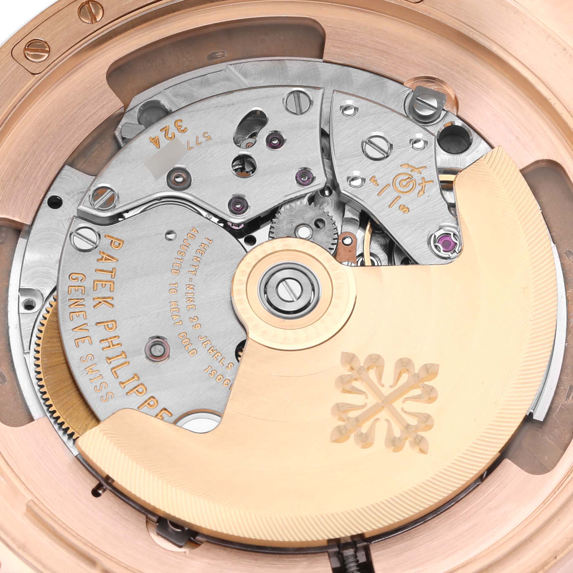 The image shows the movement of a Patek Philippe Calatrava 5227R-001 Men's Rose Gold Champagne Dial 5227R-001 Men's Rose Gold Champagne Dial watch from the back, highlighting its intricate components.