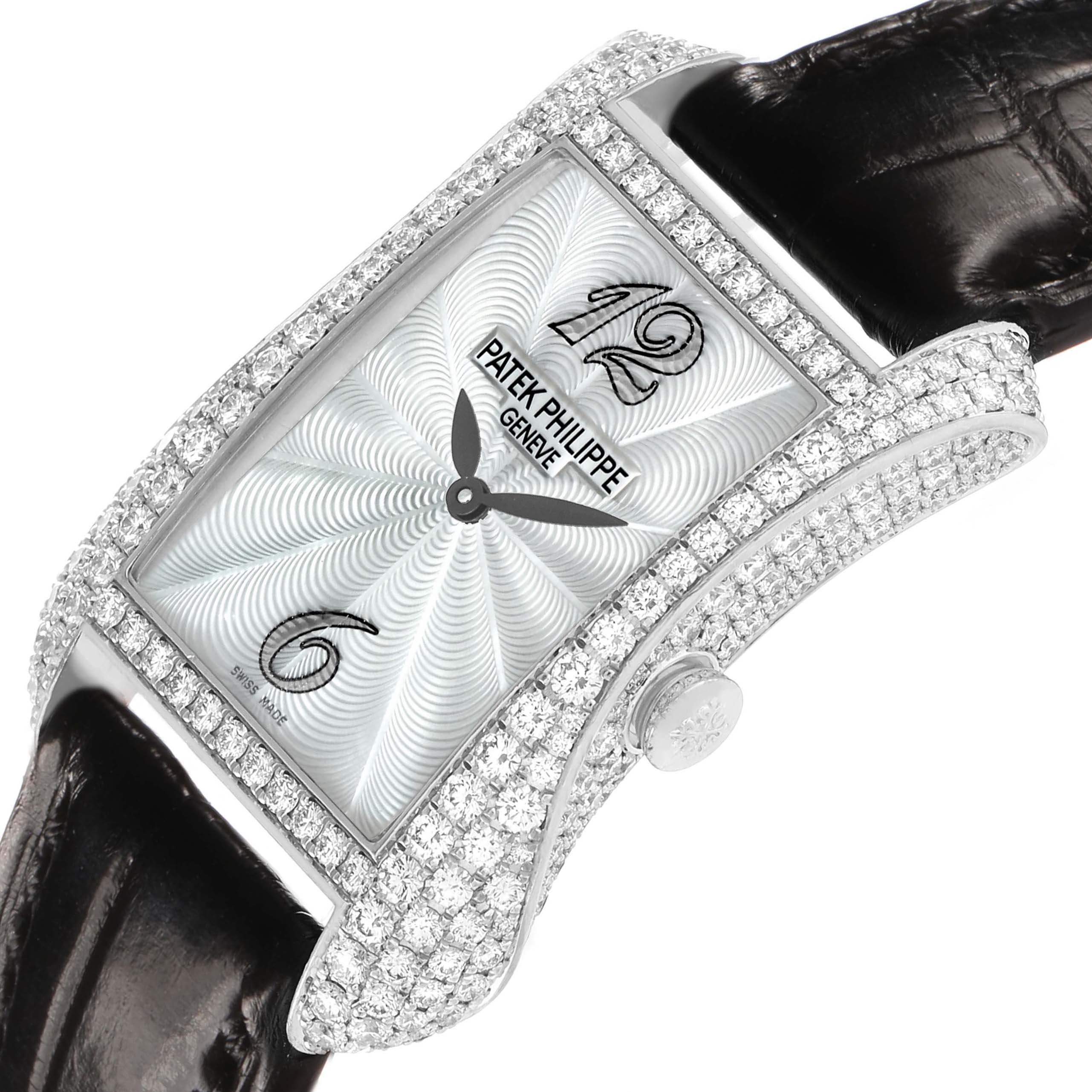 The Patek Philippe Gondolo 4973G Women's White Gold Mother of Pearl Dial watch is shown at a slight angle, highlighting its diamond-studded case, dial, and leather strap.