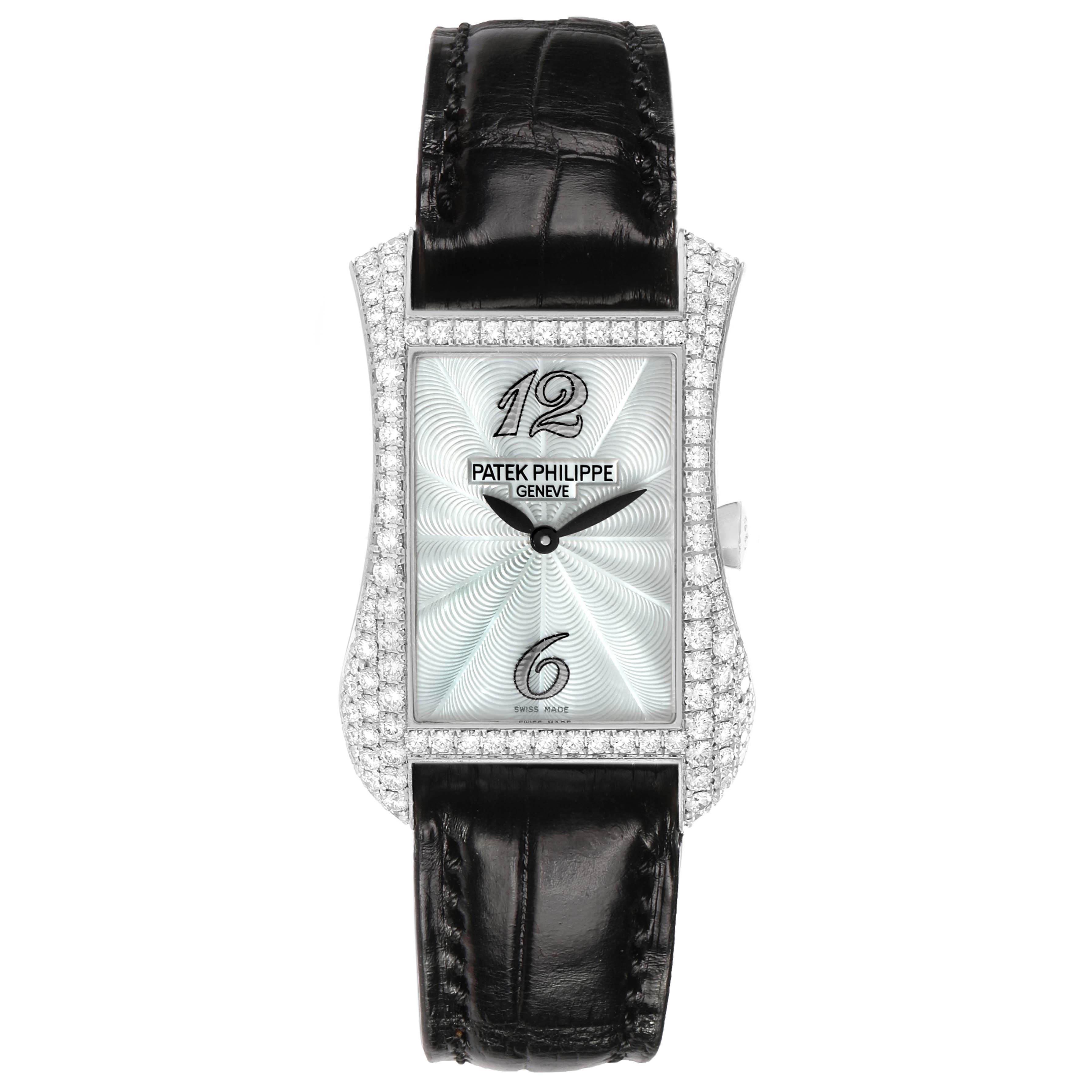 The Patek Philippe Gondolo 4973G Women's White Gold Mother of Pearl Dial watch is shown from a front angle, highlighting its rectangular face, diamond bezel, and black strap.