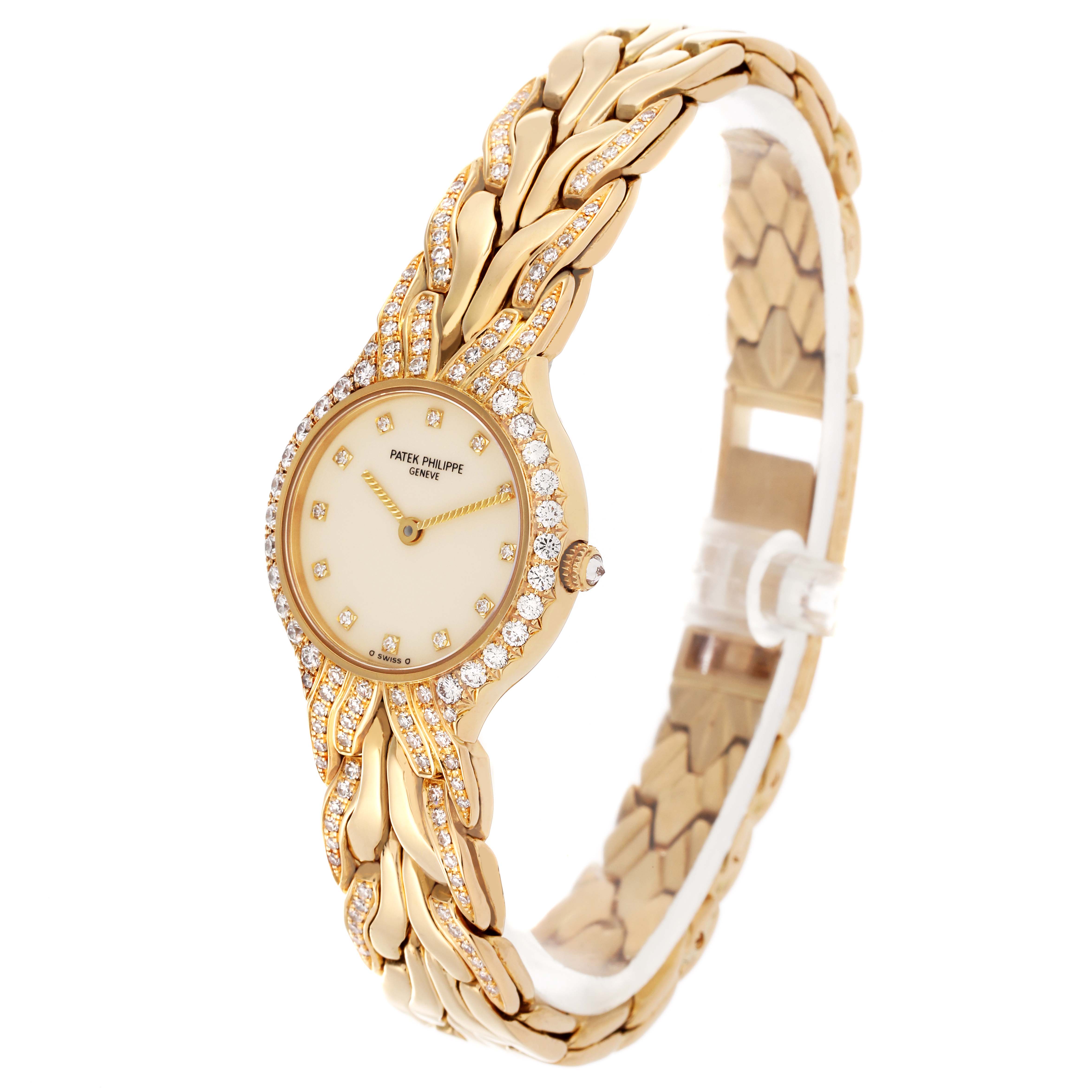 The Patek Philippe La Flamme  4816/3J Women's Yellow Gold Champagne Dial 4816/3J Women's Yellow Gold Champagne Dialwatch is shown at an angle highlighting the face, case, and intricate bracelet design.