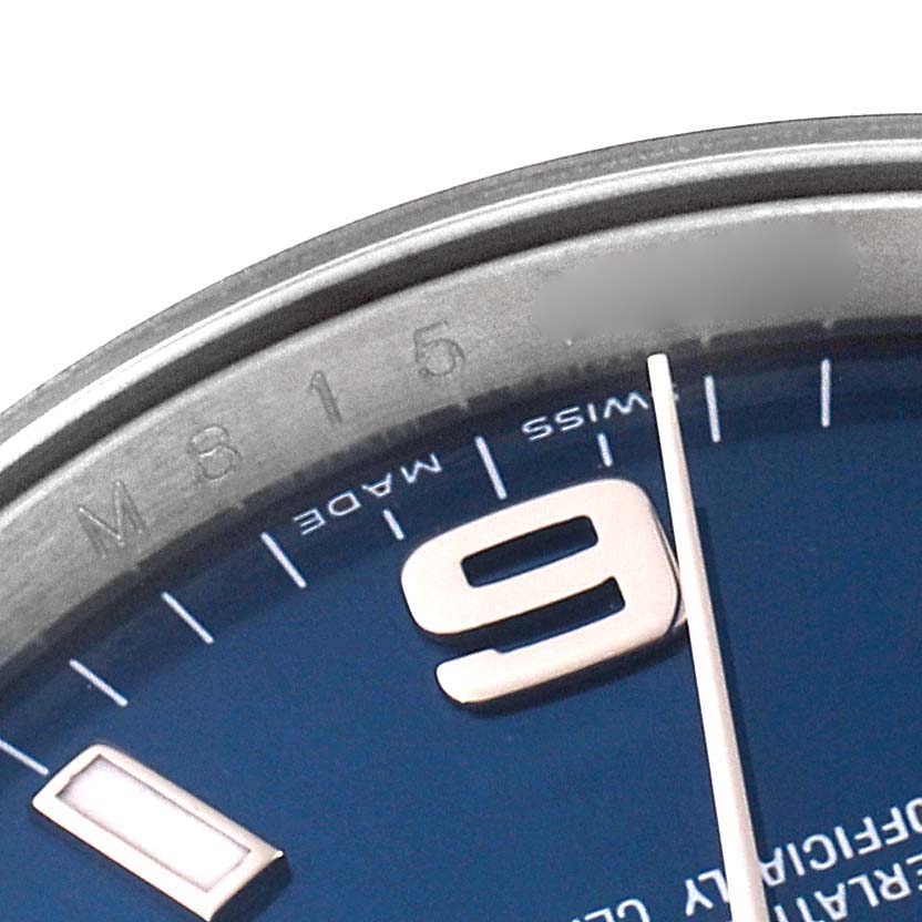 The image shows a close-up of the Rolex Air-King 114200 Men's Stainless Steel Blue Dial 114200 Men's Stainless Steel Blue Dial watch, focusing on the numerals, minute markers, and part of the bezel.