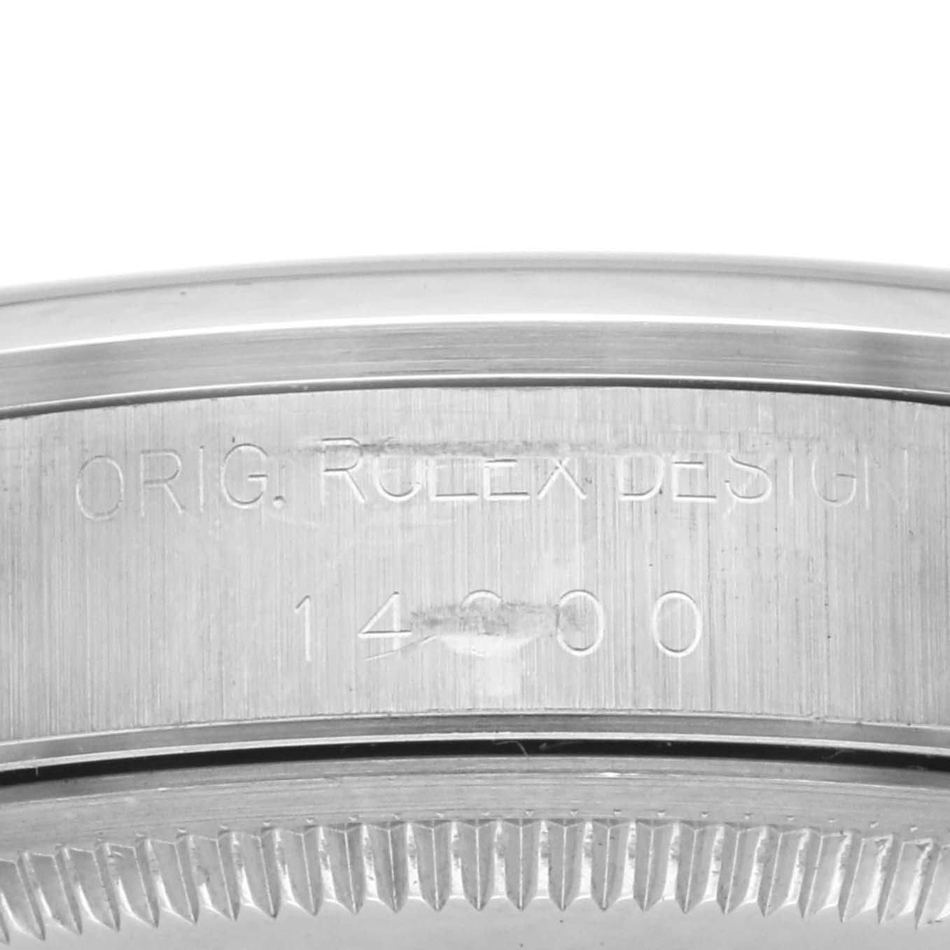 The image shows a side view of the Rolex Air-King 14000 Men's Stainless Steel Silver Dial 14000 Men's Stainless Steel Silver Dial's engraved case, displaying the model number and original design text.