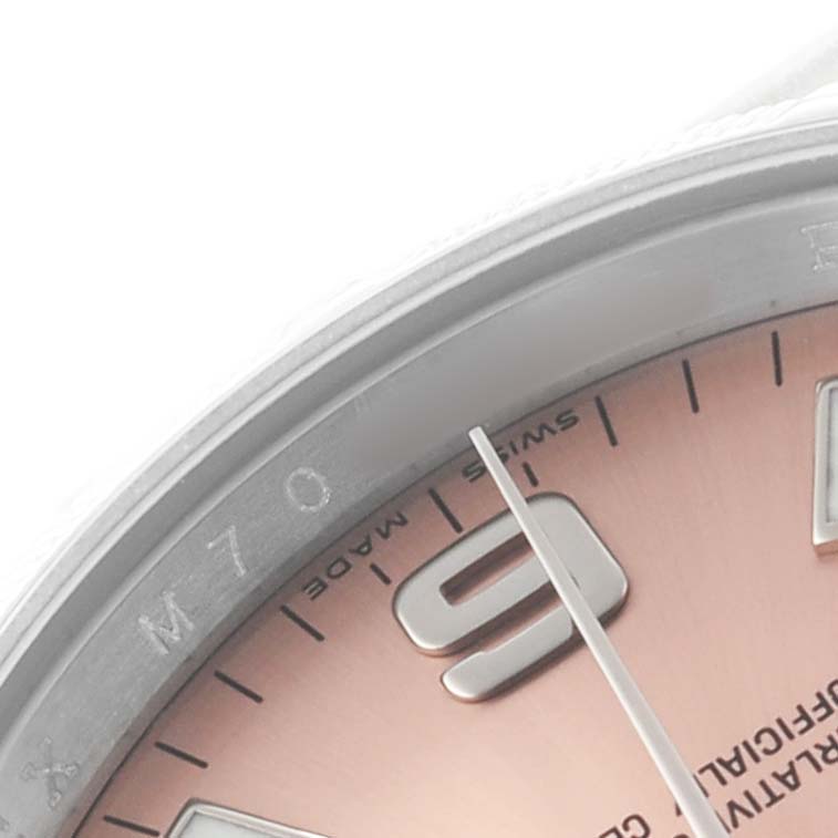 The image shows a close-up of the Rolex Air-King 114210 Men's Stainless Steel Pink Dial watch, highlighting the dial, part of the bezel, and the 9 o'clock marker.