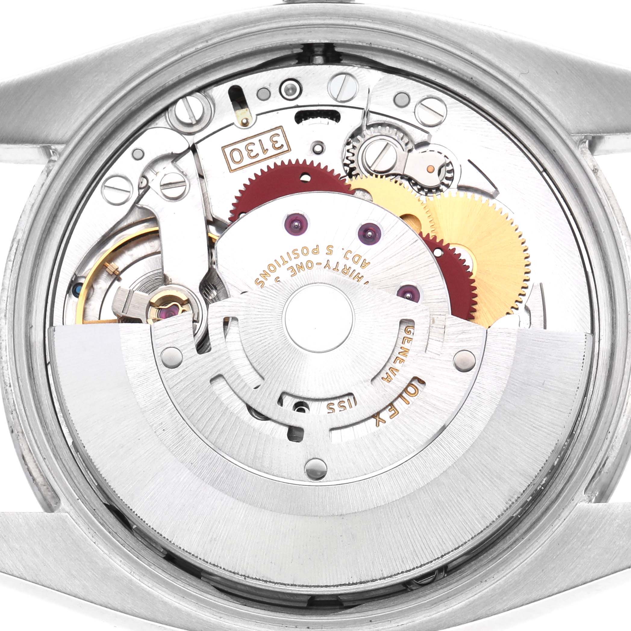 The image shows the internal movement of a Rolex Air-King 114210 Men's Stainless Steel Pink Dial watch, viewed from the back, highlighting gears and the rotor.