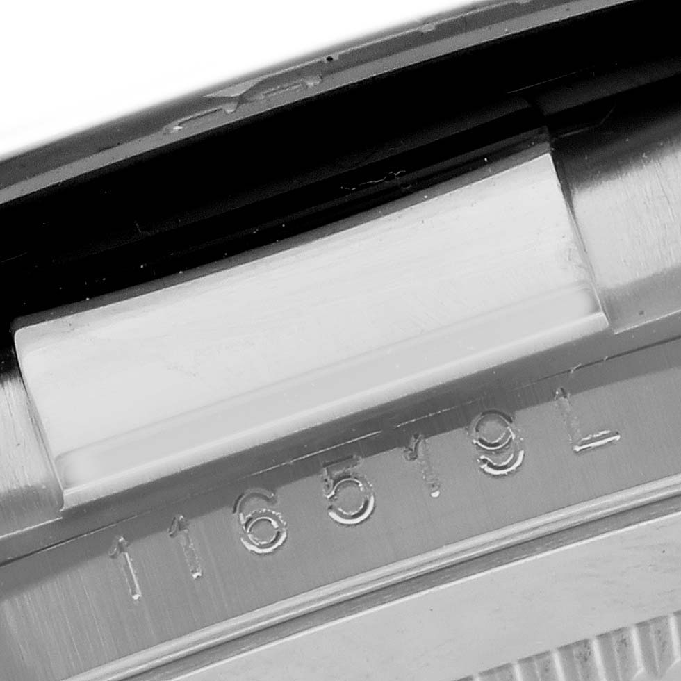 The image shows a close-up of the Rolex Daytona 116519LN Men's White Gold Mother of Pearl Dial 116519LN Men's White Gold Mother of Pearl Dial model's engraved serial number on the watch case side.