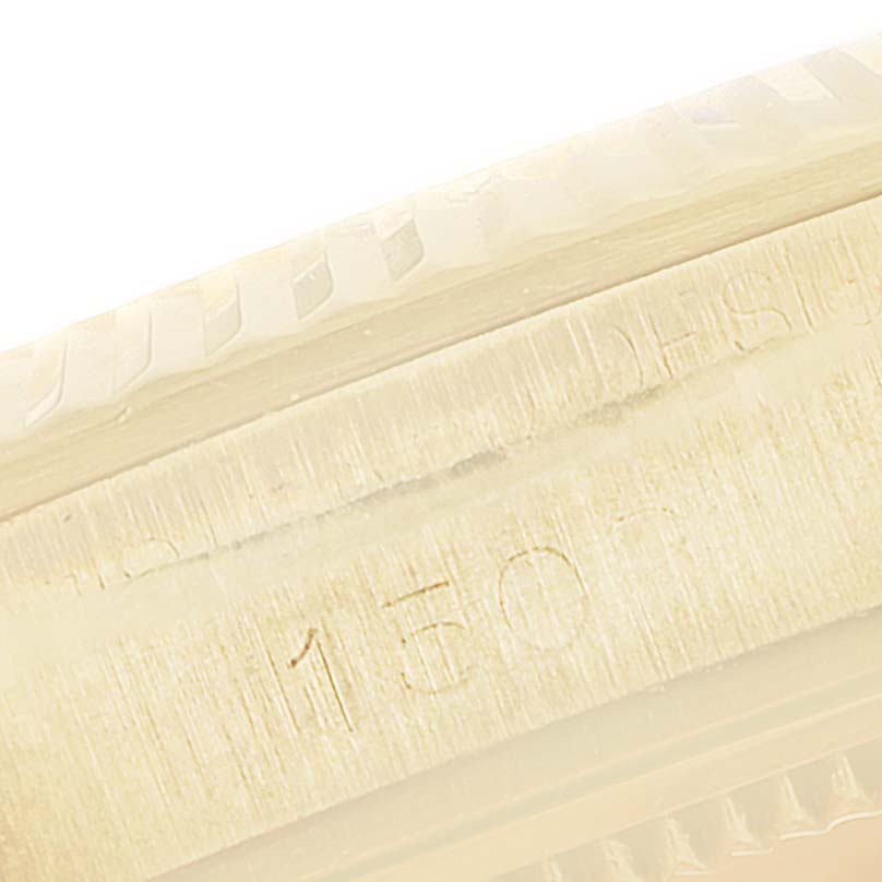 This image shows a close-up of the engraved bezel and reference number of a Rolex President 1503 Men's Yellow Gold Champagne Dial 1503 Men's Yellow Gold Champagne Dial model watch.