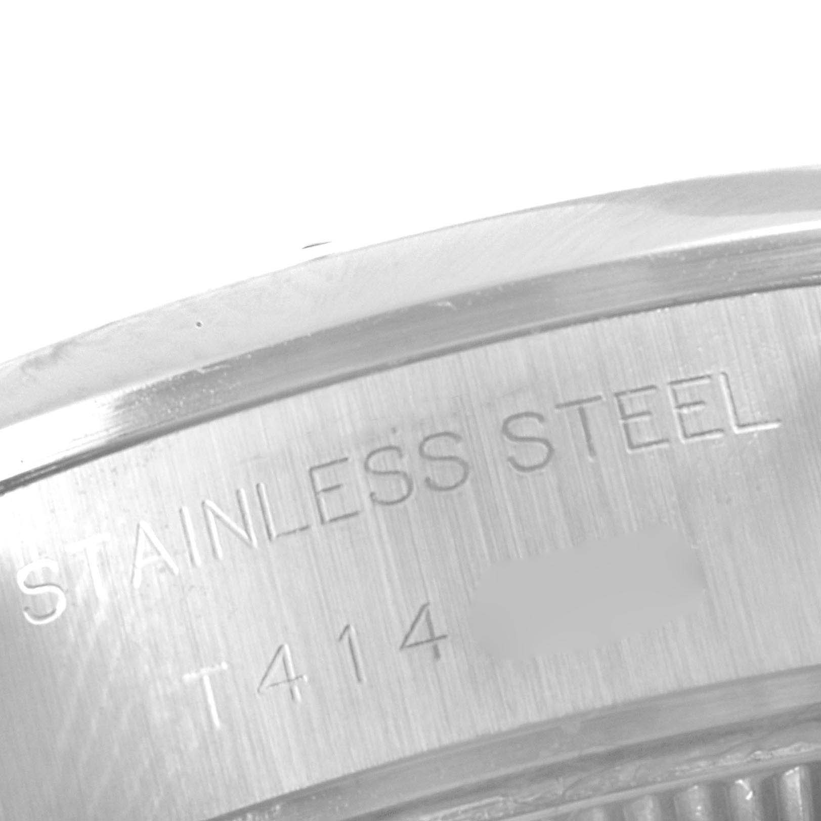 This image shows a close-up of the stainless steel casing and serial number of a Rolex Date 69160 Women's Stainless Steel Silver Dial 69160 Women's Stainless Steel Silver Dial model watch.