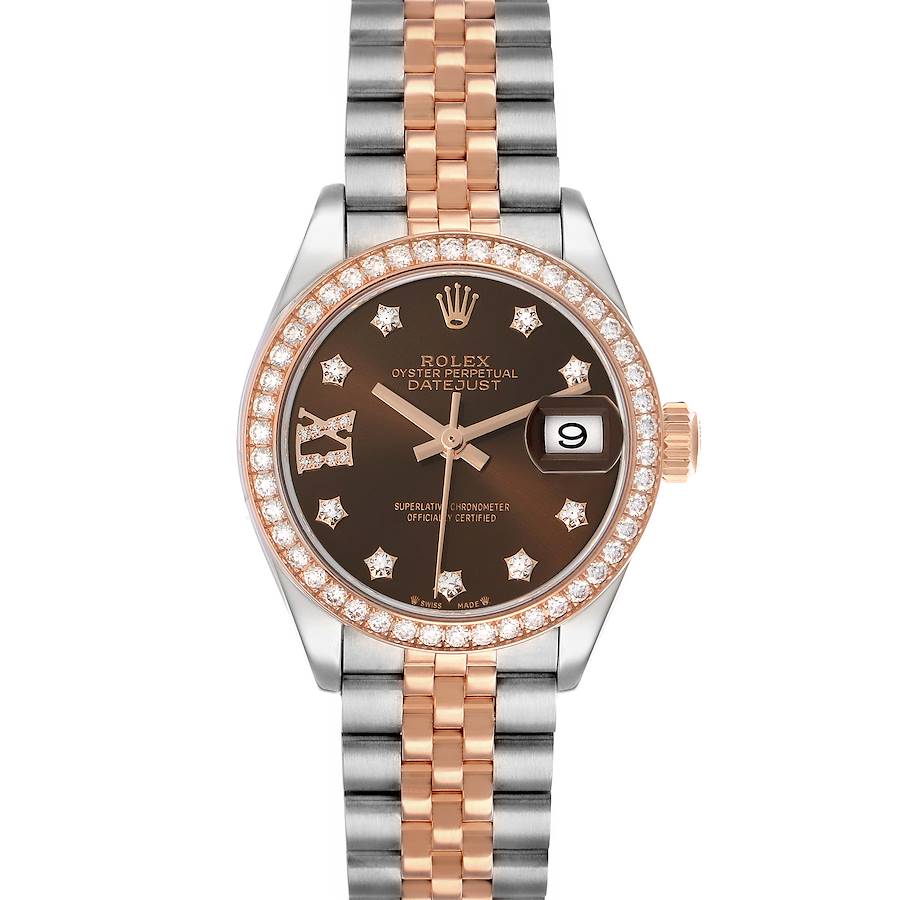 The Rolex Datejust 279381 Women's Steel and Gold (two tone) Brown Dial watch is shown from a top-down angle, displaying its brown dial, diamond markers, bezel, and two-tone bracelet.