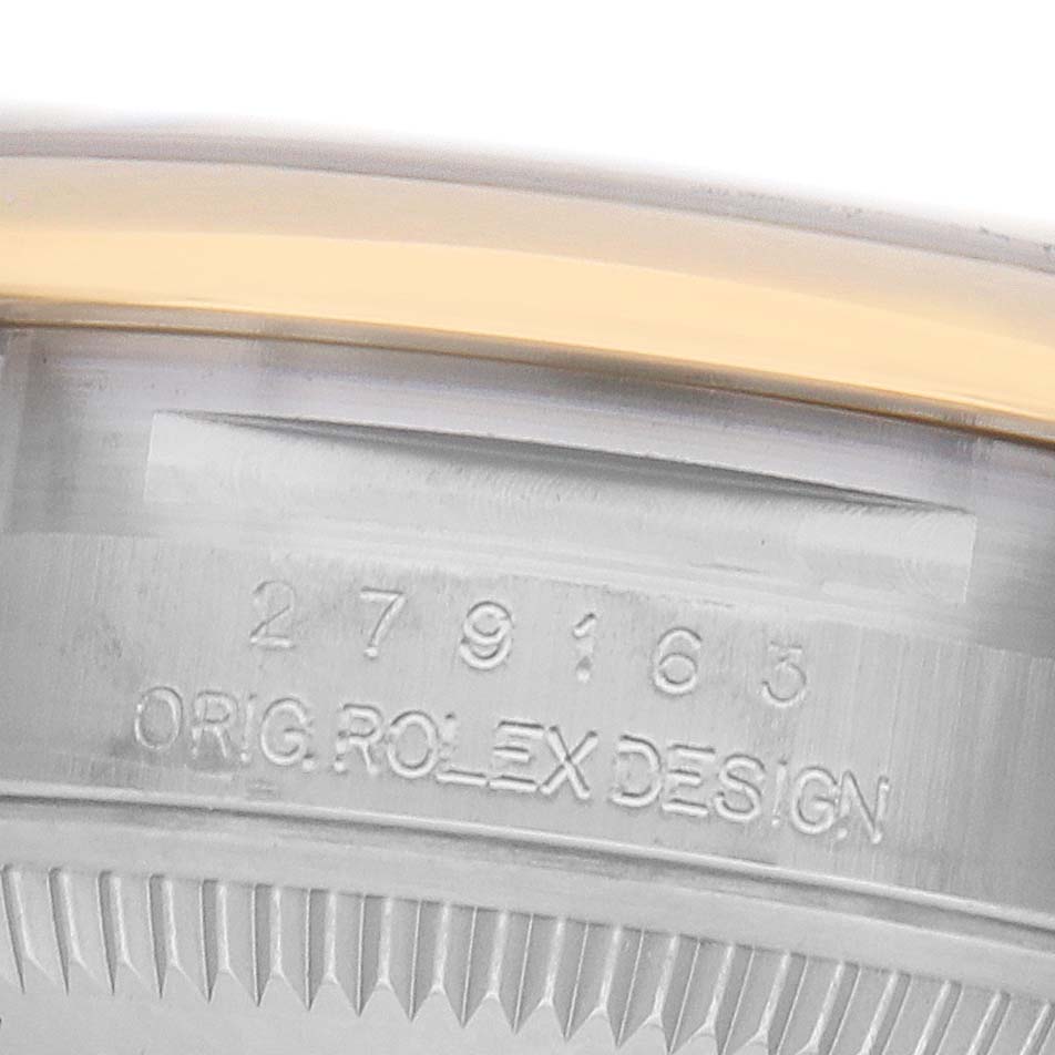 The image shows a close-up of the Rolex Datejust 279163 Women's Steel and Gold (two tone) Champagne Dial model's case side, displaying engraved design details.