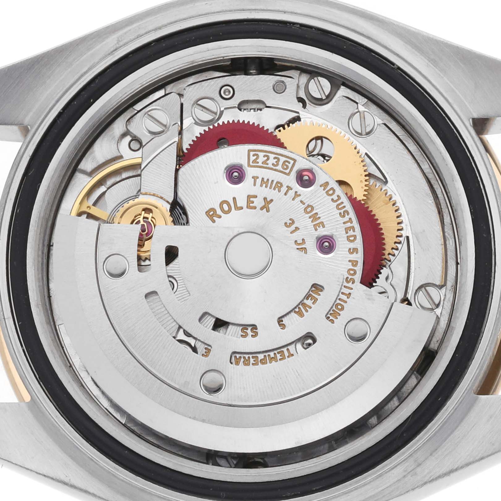 The image shows the movement of a Rolex Datejust 279163 Women's Steel and Gold (two tone) Champagne Dial watch from a back angle, highlighting gears and inscriptions.