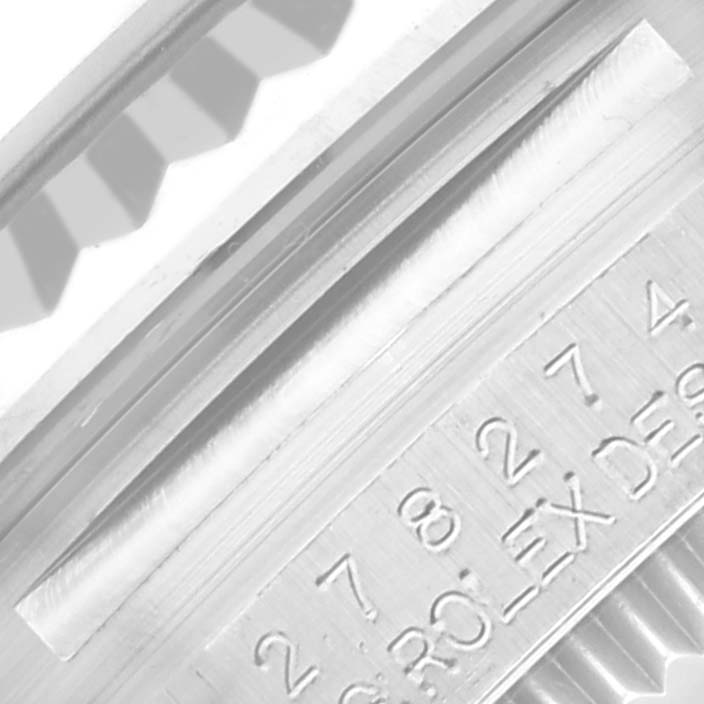 The image shows a close-up of the side engraving and edge of a Rolex Mid-Size 278274 Women's Stainless Steel Silver Dial 278274 Women's Stainless Steel Silver Dial watch.