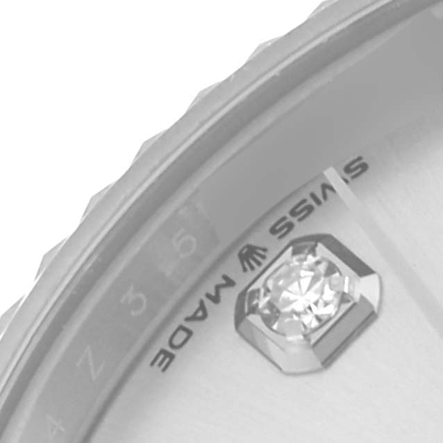 The image shows a close-up of a Rolex Mid-Size 278274 Women's Stainless Steel Silver Dial 278274 Women's Stainless Steel Silver Dial watch's dial edge with a focus on the diamond hour marker and "Swiss Made" text.