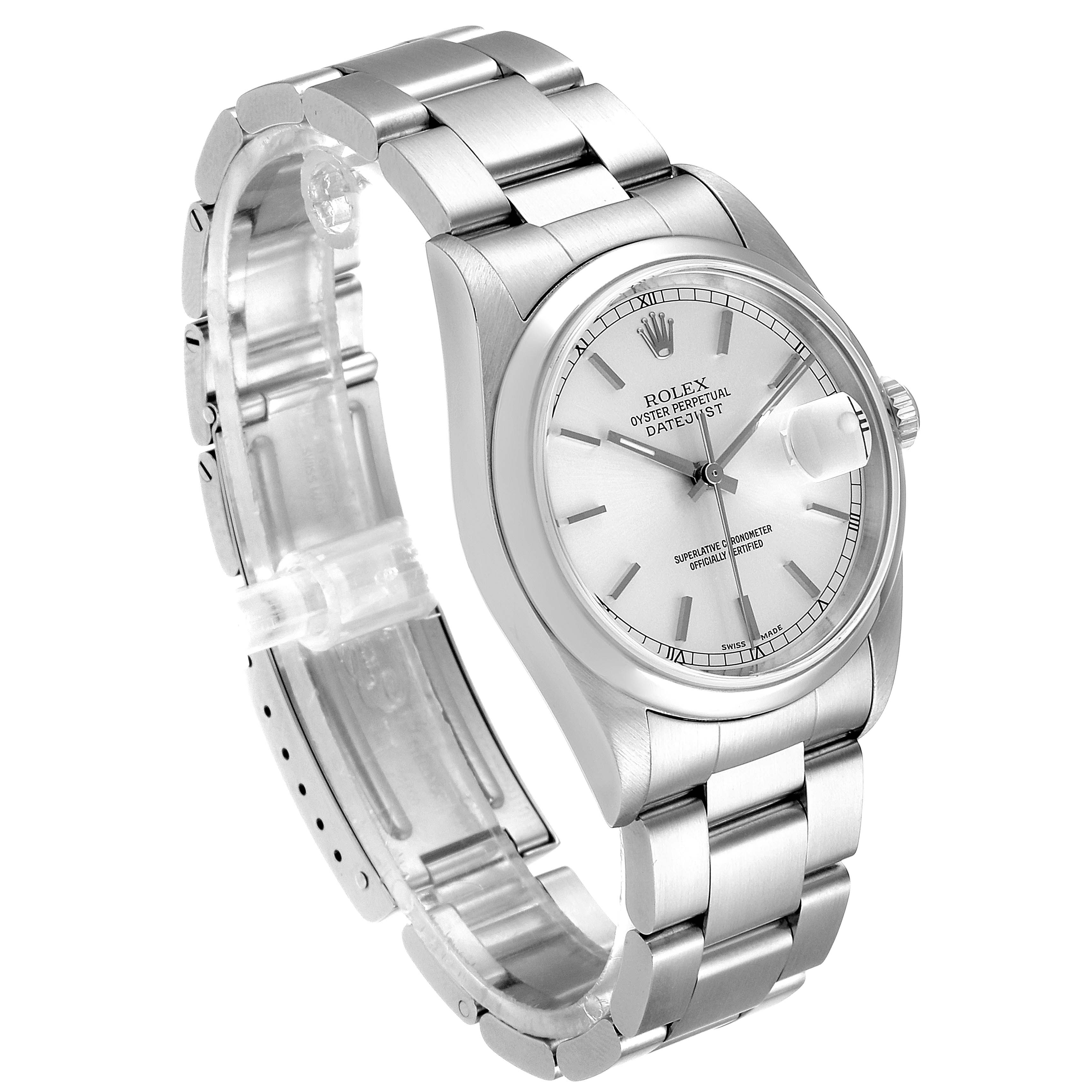 The Rolex Datejust 16200 Men's Stainless Steel Silver Dial 16200 Men's Stainless Steel Silver Dial watch is shown at a tilted angle, highlighting its stainless steel band, case, and foldable clasp.