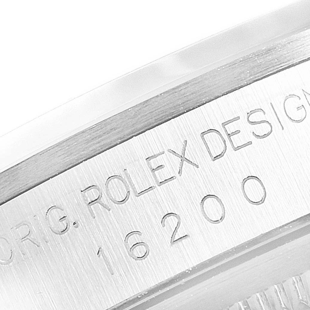 The image shows a close-up of the Rolex Datejust 16200 Men's Stainless Steel Silver Dial 16200 Men's Stainless Steel Silver Dial model 16200 case side, featuring the "ROLEX DESIGN" engraving.
