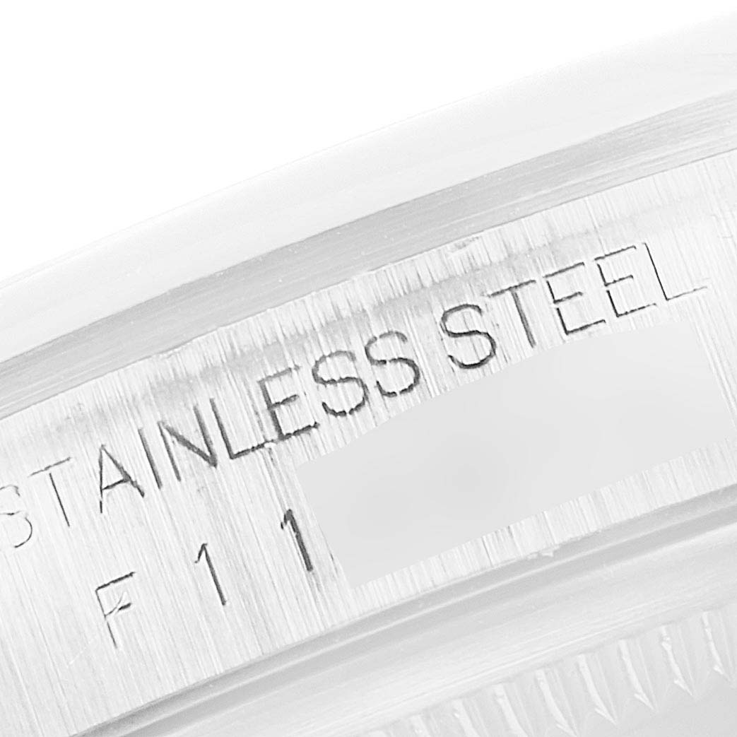 This image shows a close-up of the stainless steel rim on a Rolex Datejust 16200 Men's Stainless Steel Silver Dial 16200 Men's Stainless Steel Silver Dial watch.