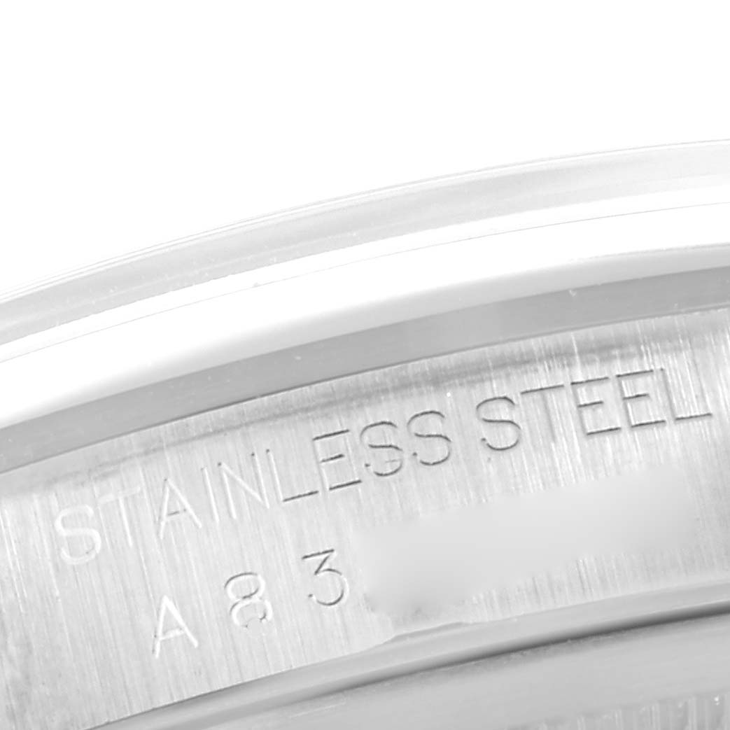 This close-up image shows the engraved text on the stainless steel case back of a Rolex Datejust 16200 Men's Stainless Steel Blue Dial 16200 Men's Stainless Steel Blue Dial watch.