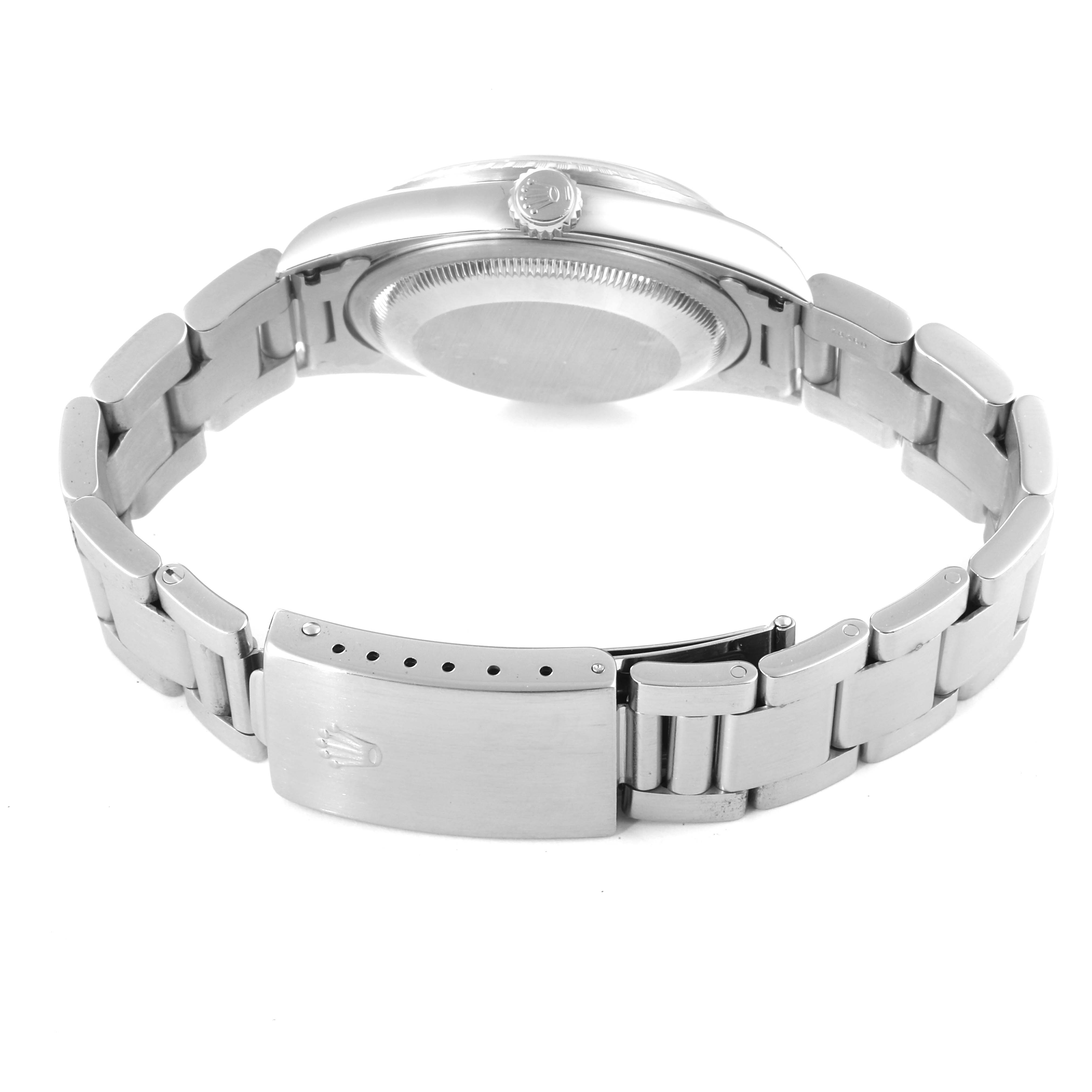 This image shows the back view of a Rolex Datejust 16220 Men's Stainless Steel Blue Dial 16220 Men's Stainless Steel Blue Dial watch, displaying the case back, crown, and bracelet clasp.