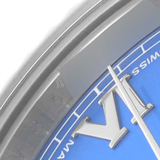 The image shows a close-up of the Rolex Datejust 41 116334 Men's Stainless Steel Blue Dial 116334 Men's Stainless Steel Blue Dial dial, highlighting a portion of the hour markers and hands.