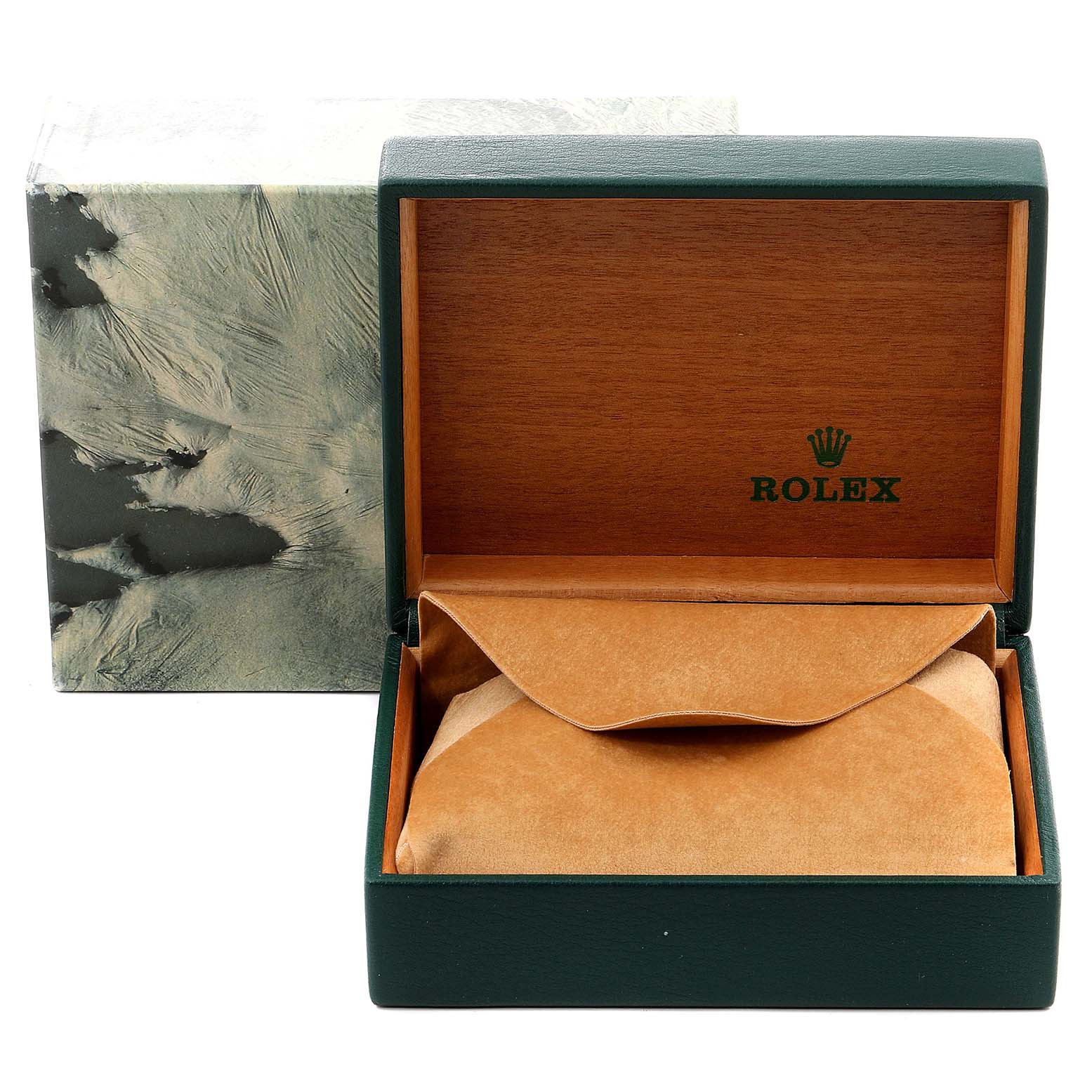 The image shows an open Rolex box with a brown interior, a cushioned compartment, and the outer packaging behind it.