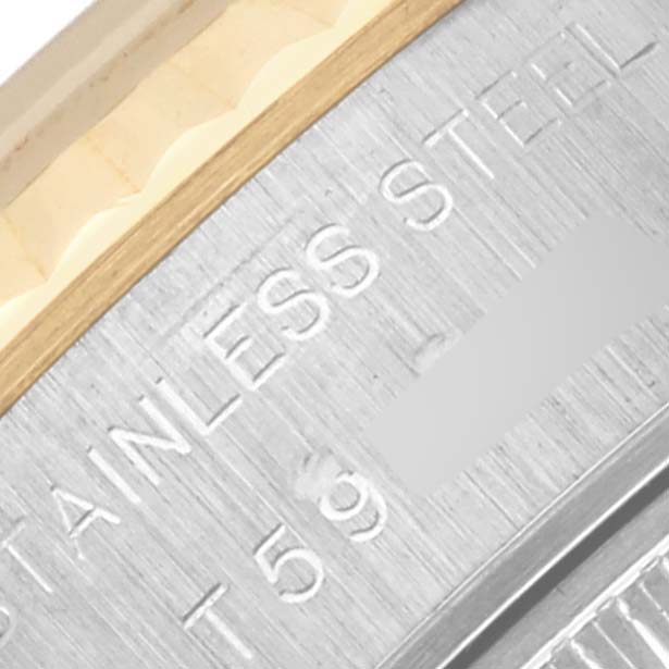 The image shows a close-up of the side engraving on the stainless steel case of a Rolex Datejust 69173 Women's Steel and Gold (two tone) White Dial 69173 Women's Steel and Gold (two tone) White Dial watch.