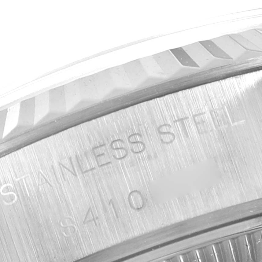 This close-up image shows the side engraving and part of the bezel of the Rolex Datejust 69174 Women
s Stainless Steel Silver Dial 69174 Women
s Stainless Steel Silver Dial watch.