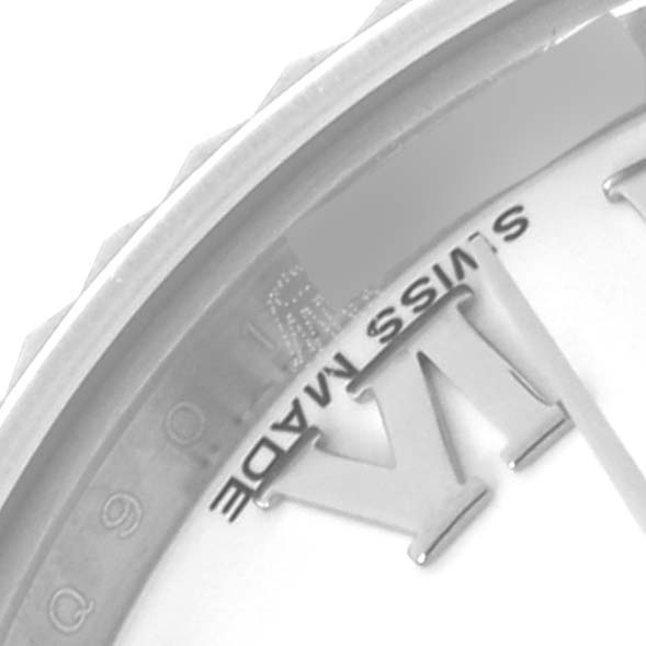 The image shows a macro view of the Rolex Datejust 179174 Women's Stainless Steel White Dial 179174 Women's Stainless Steel White Dial watch, highlighting the bezel and part of the dial with Roman numerals.