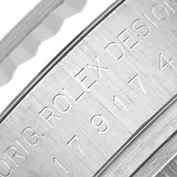 The image shows the engraved inner bezel of a Rolex Datejust 179174 Women's Stainless Steel White Dial 179174 Women's Stainless Steel White Dial watch, featuring part of the model number and brand name.