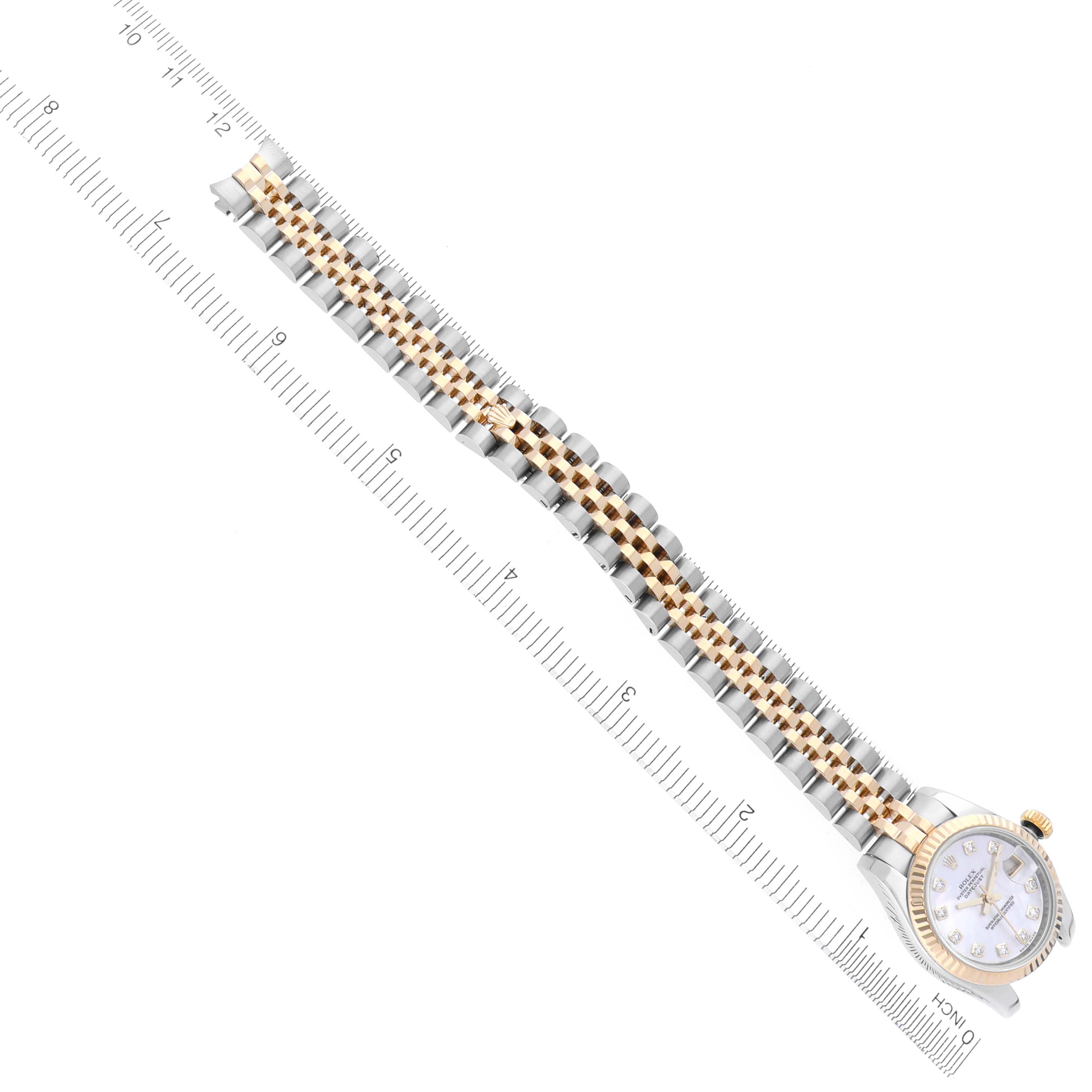 The Rolex Datejust 179173 Women's Steel and Gold (two tone) Mother of Pearl Dial 179173 Women's Steel and Gold (two tone) Mother of Pearl Dial watch is shown from a top-down angle, displaying the full bracelet and face.