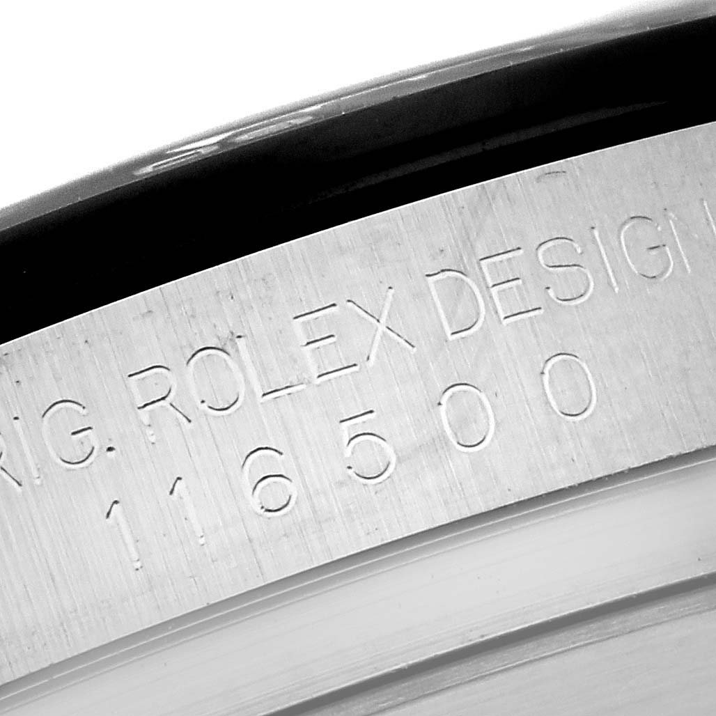 The image shows a close-up of the engraved inner bezel of the Rolex Daytona 116500LN Men's Stainless Steel Black Dial 116500LN Men's Stainless Steel Black Dial watch.