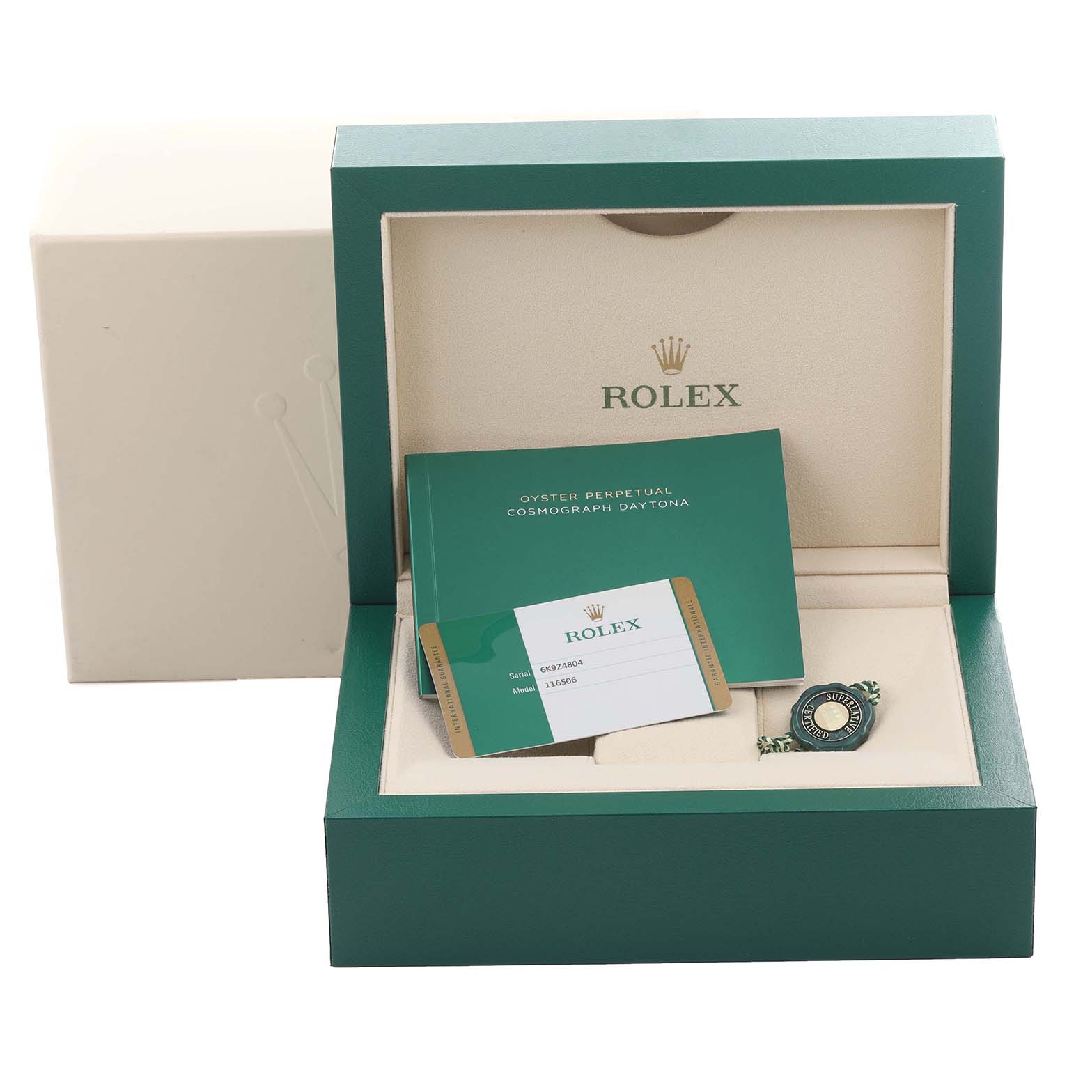 The image shows a Rolex Daytona 116506 Men's Platinum Blue Dial 116506 Men's Platinum Blue Dial watch box with a guarantee card and booklet, highlighting brand accessories.