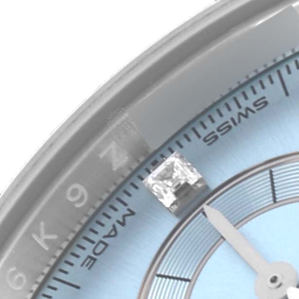 The image shows a close-up of the Rolex Daytona 116506 Men's Platinum Blue Dial 116506 Men's Platinum Blue Dial watch face, highlighting the hour markers and part of the bezel.